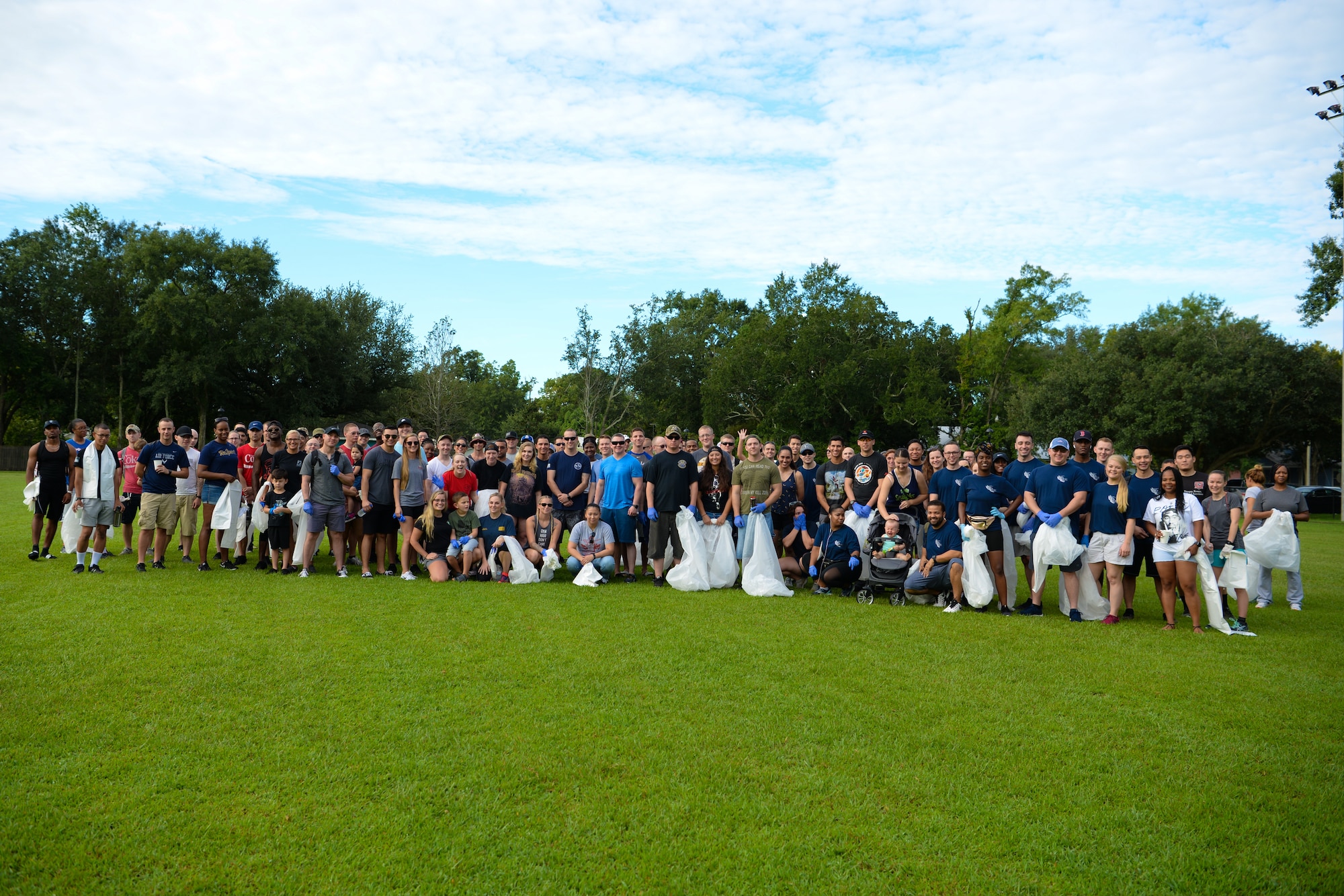 Volunteers get together for group photo during the Community Clean-Up Day in Ocean Springs, Mississippi, Aug. 24, 2019. Volunteers coming from Ocean Springs and Keesler Air Force Base took to the streets of Ocean Springs to pick up trash around the city. (U.S Air Force photo by Airman 1st Class Spencer Tobler)