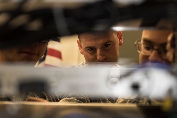 Staff Sgt. Jeremy Dauzat, 47th Operations Support Squadron Radar Airfield Weather Systems supervisor checks voltage levels with RAWS Airmen at Laughlin Air Force Base, Texas, Aug. 21, 2019, to ensure the transmitter is giving the right output so the pilots and controllers can radio one another. The radios in the ground air transmit receive site were recently replaced with newer ones which are simpler to maintain, cost fewer man-hours, and uses less space. (U.S. Air Force photo by Senior Airman Anne McCready)