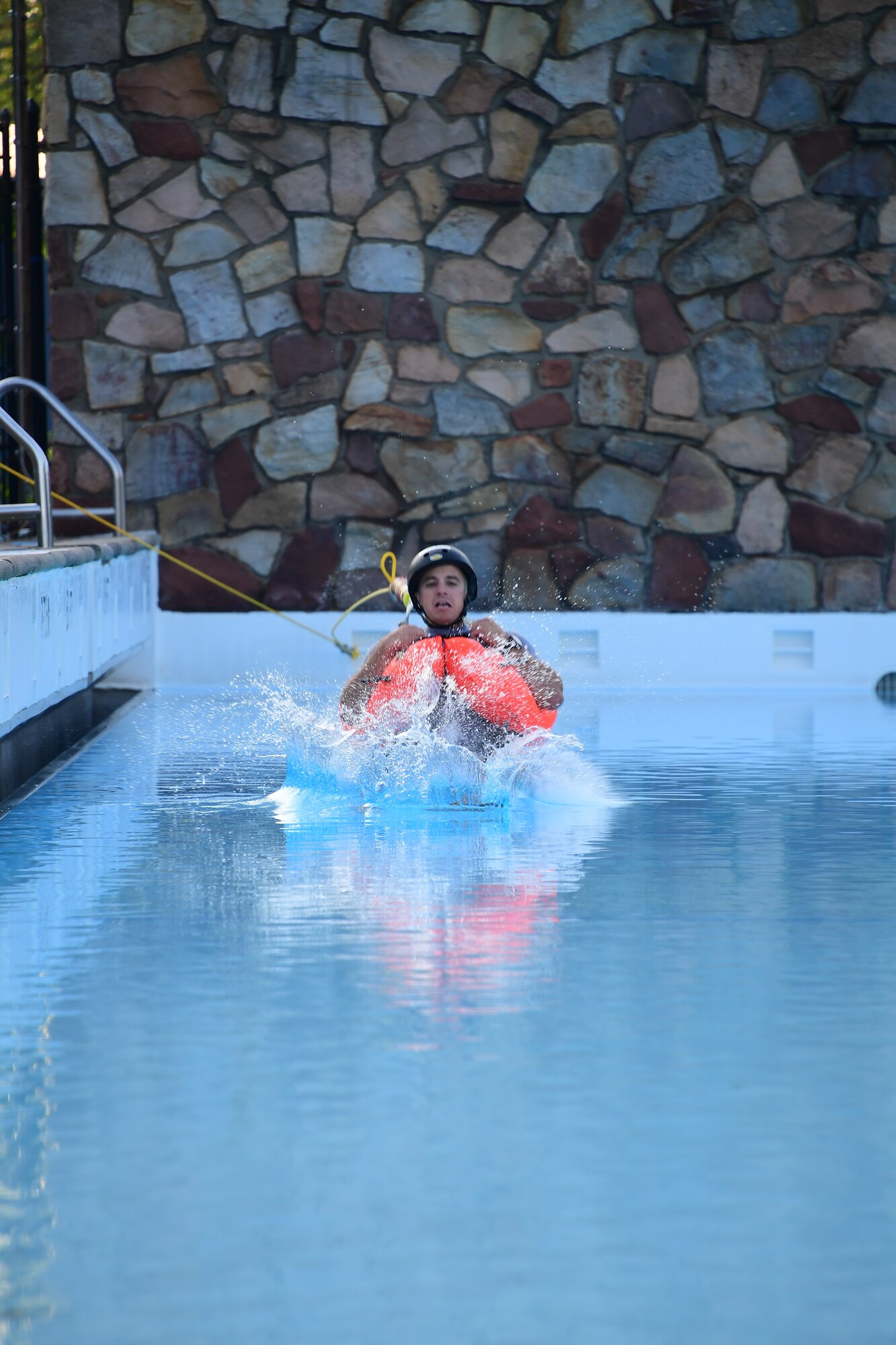 Senior Airman Nathan Pritchard, Survival, Evasion, Resistance and Escape specialist with the 445th Operations Support Squadron, demonstrates a harness drag to members of the 911th Airlift Wing at Settler’s Cabin Park in Pittsburgh, Pennsylvania, August 3, 2019. During this water survival training event, Airmen got acquainted with several pieces of survival equipment so that they would know how to react in a life-or-death-situation.