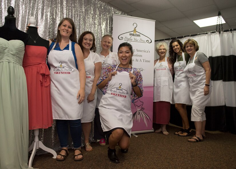 Organization volunteers pose for a photo during Operation Deploy Your Dress’ seasonal grand-opening at Joint Base Langley-Eustis, Virginia, Aug. 27, 2019.
