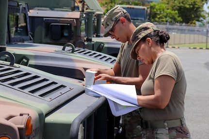 Puerto Rico National Guard members check and fuel military vehicles and electrical generators and replenish water distribution trucks on Aug. 27, 2019, in preparation to respond to Hurricane Dorian.