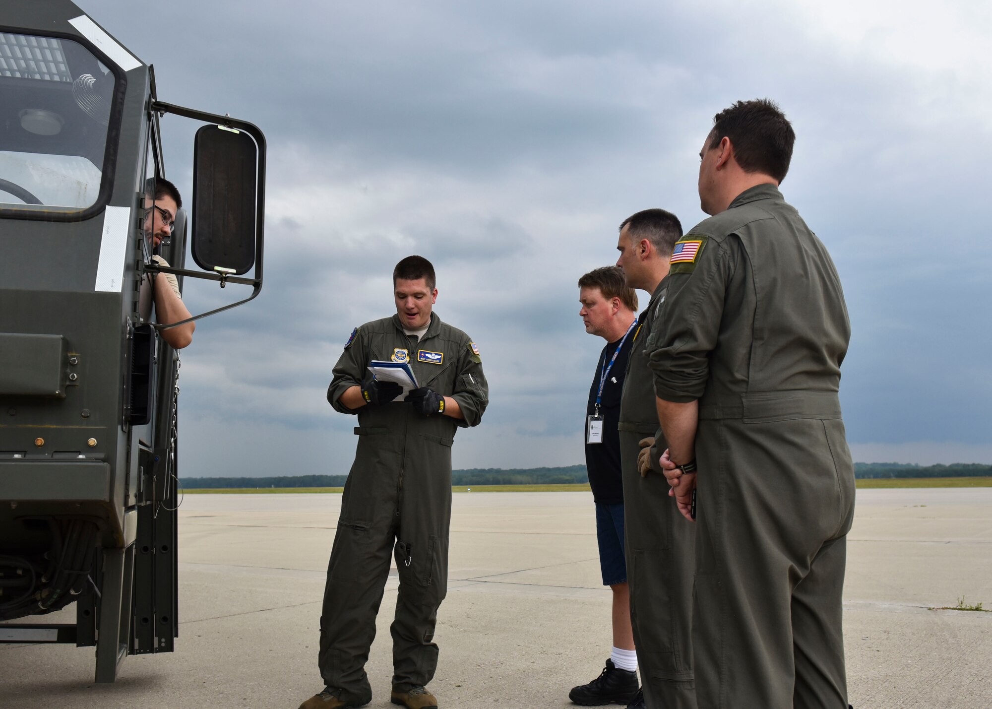 U.S. Air Force Master Sgt. Joseph Ekker gives a brief to individuals from Data Monitor Systems and Airmen from the 97th ARS