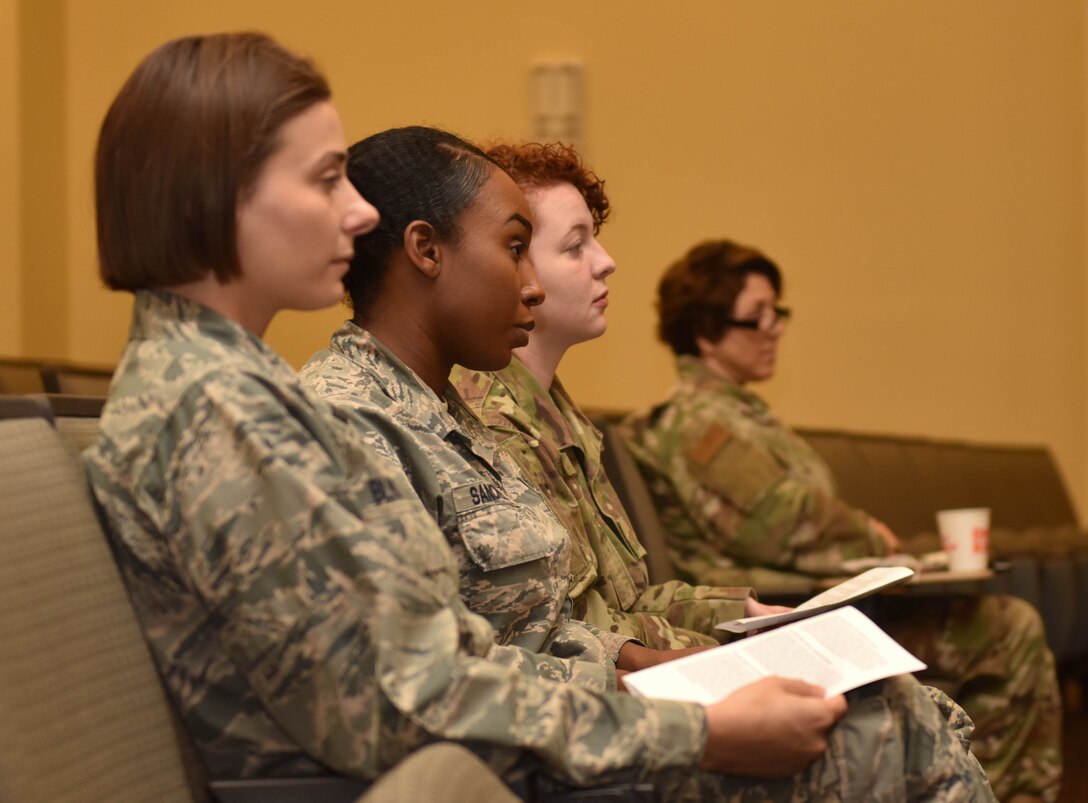 U.S. Air Force Airmen listen to a presentation about Women’s Equality Day at Joint Base Langley-Eustis, Virginia, August 28, 2019. Women’s Equality Day celebrates the passage of the 19th amendment to the U.S. constitution that guarantees all American women the right to vote.