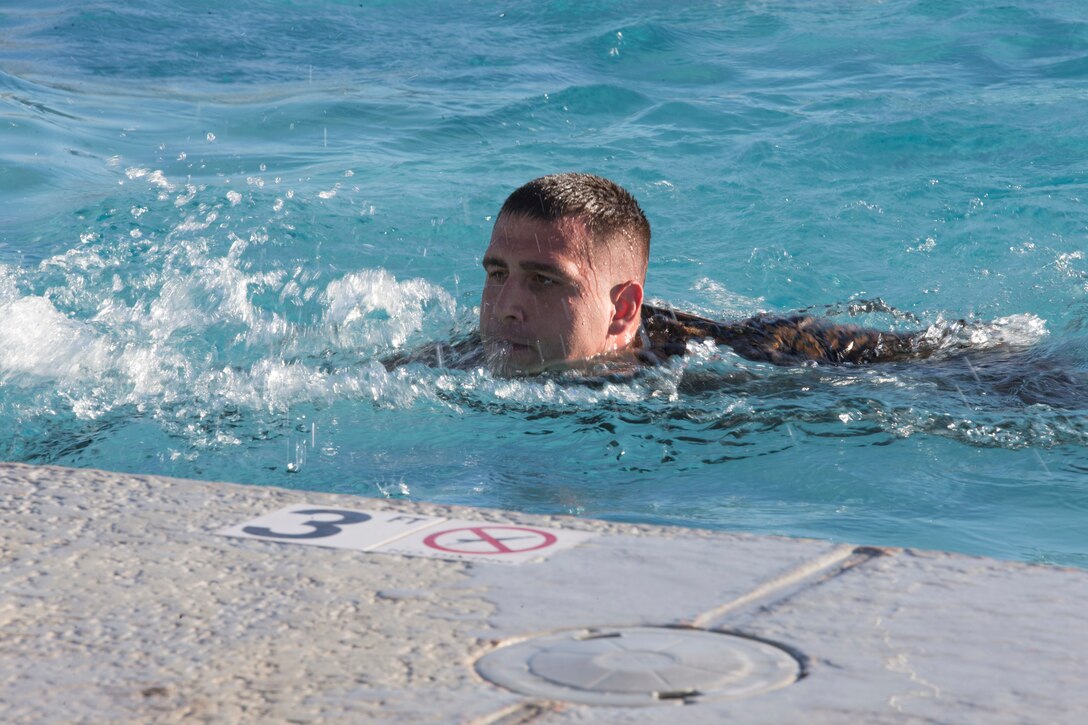 U.S. Marines stationed at Marine Corps Air Station Yuma complete their bi-annual swim qualification at the Oasis Pool on Aug. 27, 2019. Marines are known for being an amphibious assault force, so they regularly train in water to become more adept while swimming. ( Marine Corps photo by Cpl. Austin Weck)