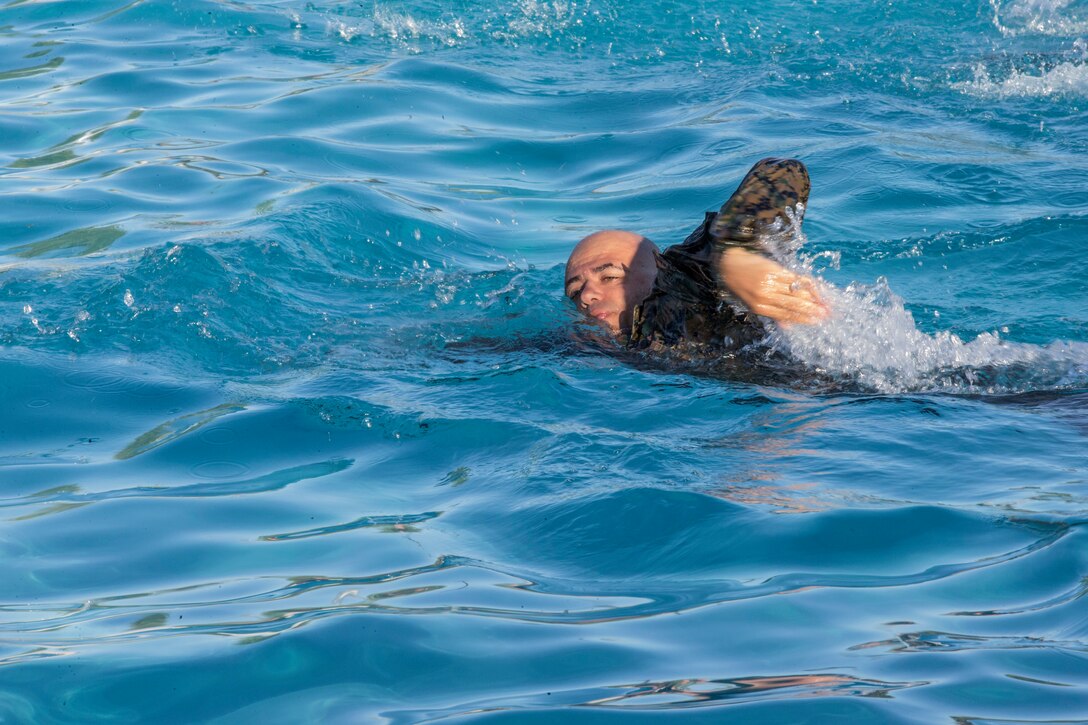 U.S. Marines stationed at Marine Corps Air Station Yuma complete their bi-annual swim qualification at the Oasis Pool on Aug. 27, 2019. Marines are known for being an amphibious assault force, so they regularly train in water to become more adept while swimming. ( Marine Corps photo by Cpl. Austin Weck)