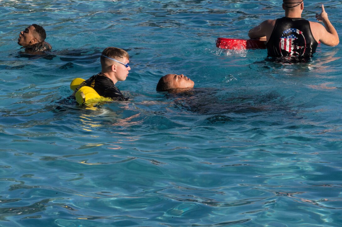 U.S. Marines stationed at Marine Corps Air Station Yuma complete their bi-annual swim qualification at the Oasis Pool on Aug. 27, 2019. Marines are known for being an amphibious assault force, so they regularly train in water to become more adept while swimming. ( Marine Corps photo by Cpl. Austin Weck)