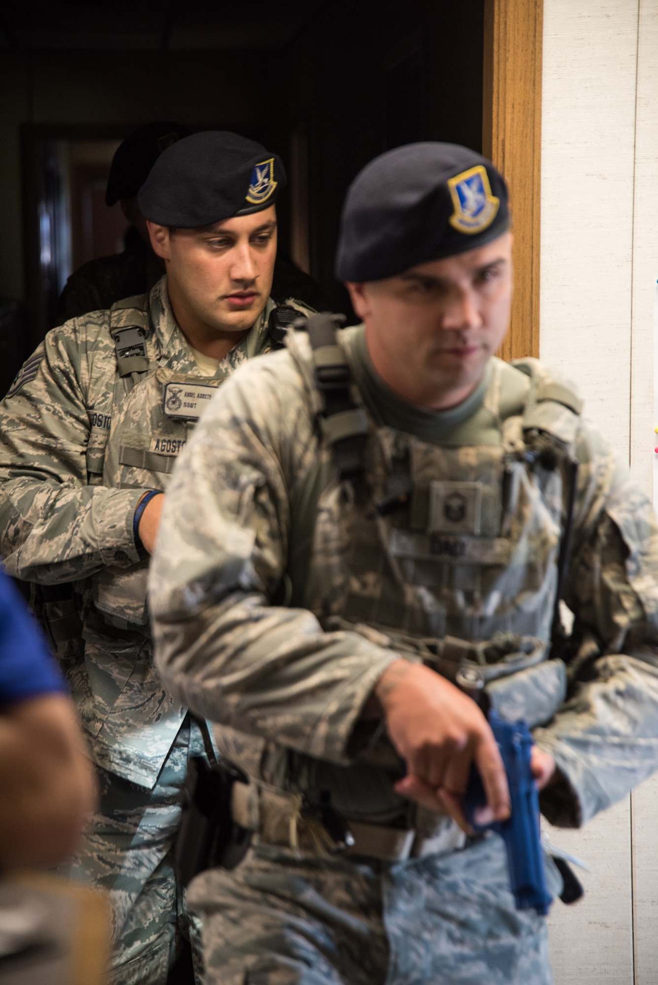 U.S. Air Force Master Sgt. Michael Daly (front) and Staff Sgt. Angel Agosto-Marrero (back), 166th Security Forces Squadron members, conduct a building search during an active-shooter exercise at New Castle Air National Guard Base, Aug. 22, 2019. During the exercise, a designated active shooter entered a building and simulated opening fire. First responders, such as Security Forces, Fire Protection and Emergency Management neutralized the threat and triaged wounded personnel, while all other personnel participated in an installation-wide lockdown. (U.S. Air National Guard Photo by Mr. Mitchell Topal)