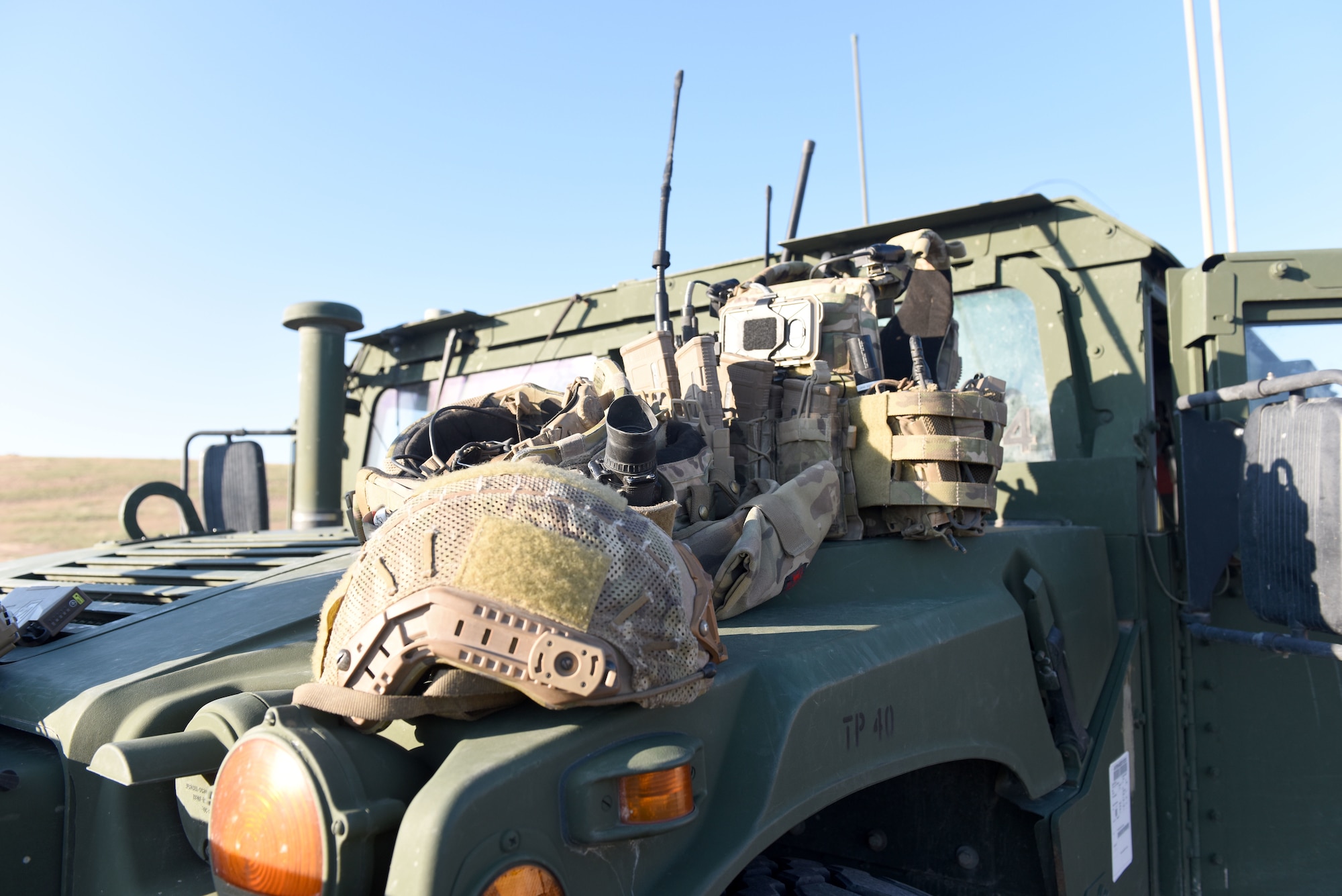Tactical Air Control Party Specialists from the 148th Air Support Operations Squadron load up their gear and vehicle.