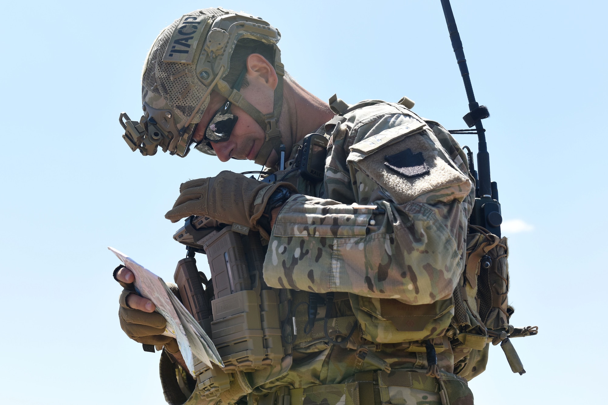 Senior Airman Zeljko Raic, a Tactical Air Control Party Specialist with the 148th Air Support Operations Squadron, checks his coordinates.