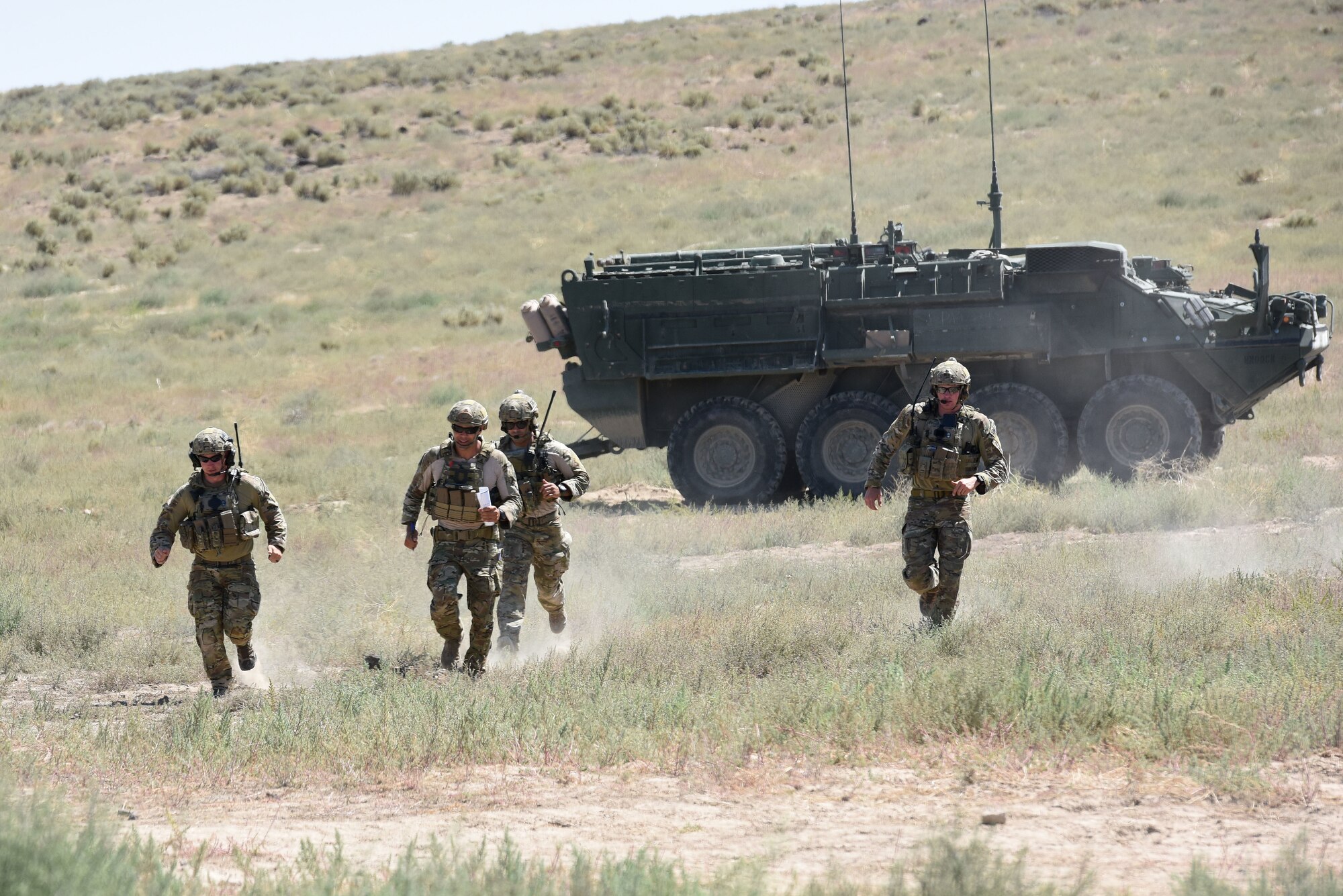 Tactical Air Control Party Specialists with the 148th Air Support Operations Squadron practice changing positions as they communicate with their A-10 air support to drop simulated munitions on a target Aug. 13, 2019.