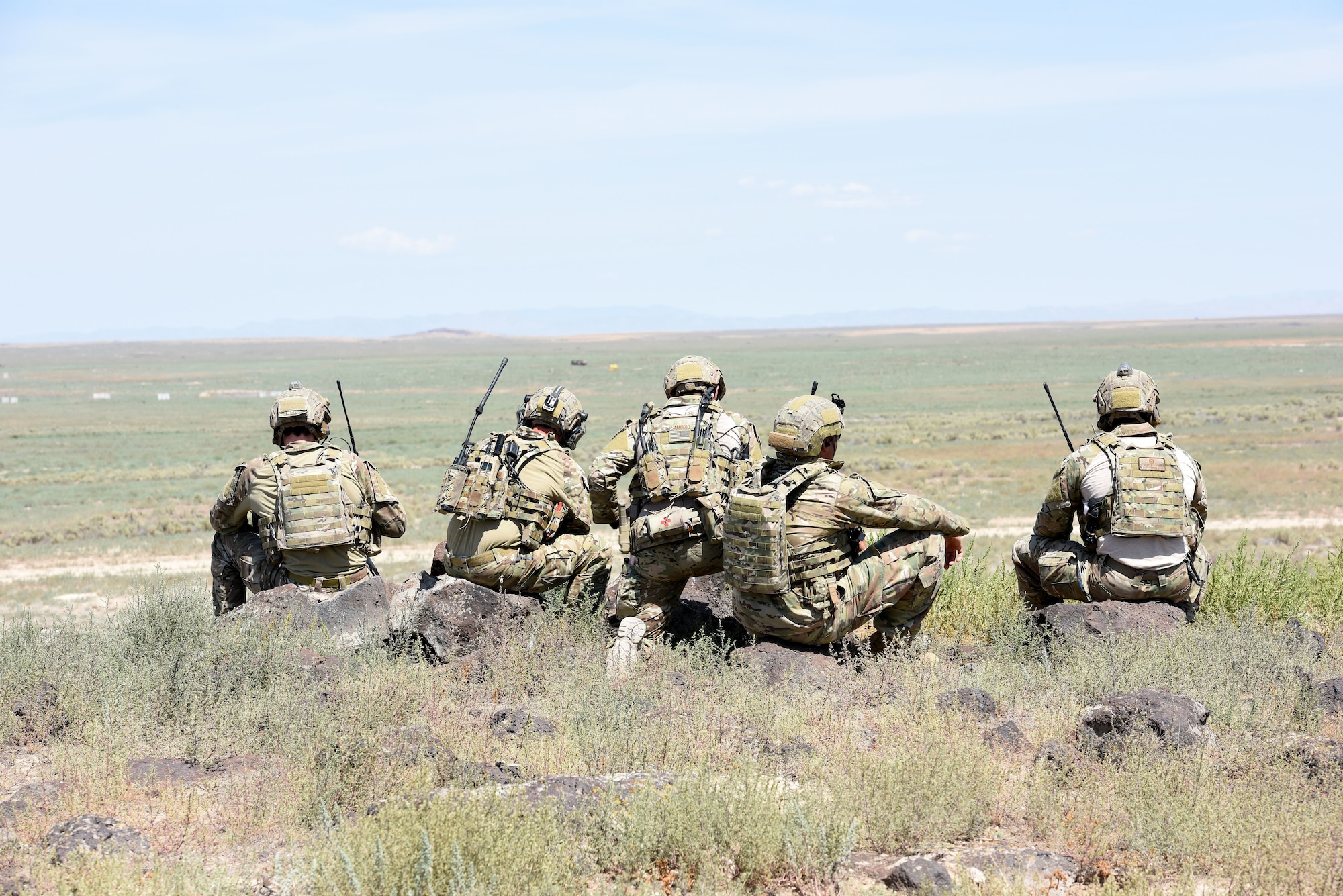 Tactical Air Control Party Specialists with the 148th Air Support Operations Squadron wait for the A-10 air support they called in to drop simulated munitions on a target Aug. 13, 2019.