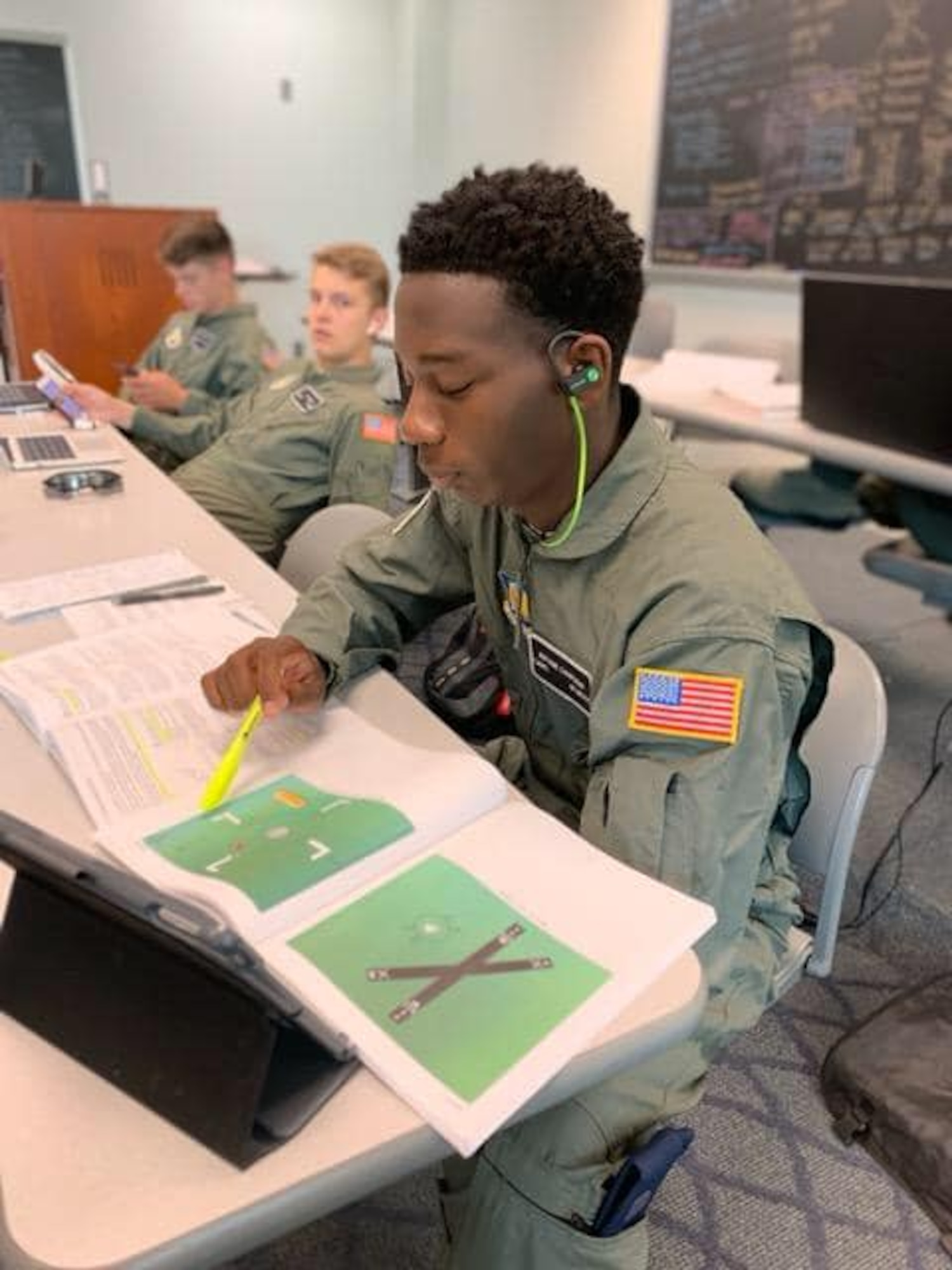 An Air Force Junior ROTC cadet focuses hard on his studies at Delaware State University, Dover, Delaware.  This summer, 150 cadets were sent to 11 universities across the country for an intensive eight-week Air Force JROTC Flight Academy program, with 45 percent of the class being female or minority.  At the end of the program, 122 high school students walked away with a positive university experience, college credit and their private pilot certification.