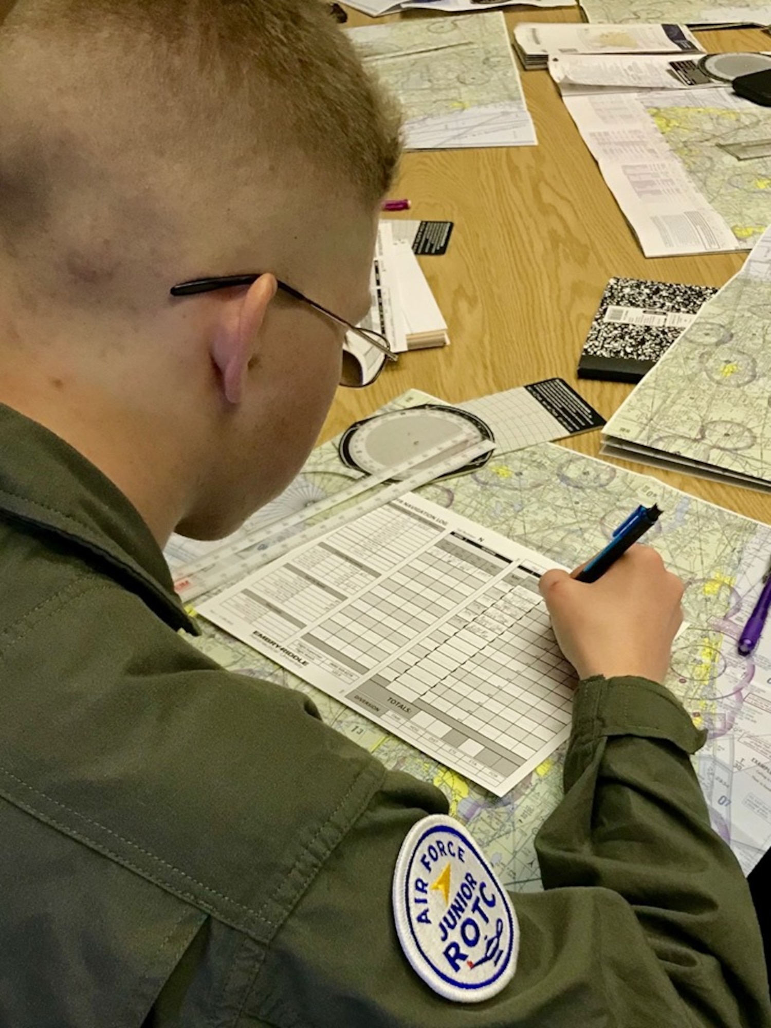 An Air Force Junior ROTC cadet at Southeastern University, Lakeland, Florida, focuses his attention on filing a flight plan as he participates in the Air Force JROTC Flight Academy.  The Flight Academy is a Chief of Staff of the Air Force Scholarship Program intended to expose high school students to the benefits of a career in aviation.  More than 1,560 cadets applied for one of the 150 scholarships each valued at approximately $20,000.  The cadets were competitively boarded to ensure only the most qualified cadets were sent to the partner universities.