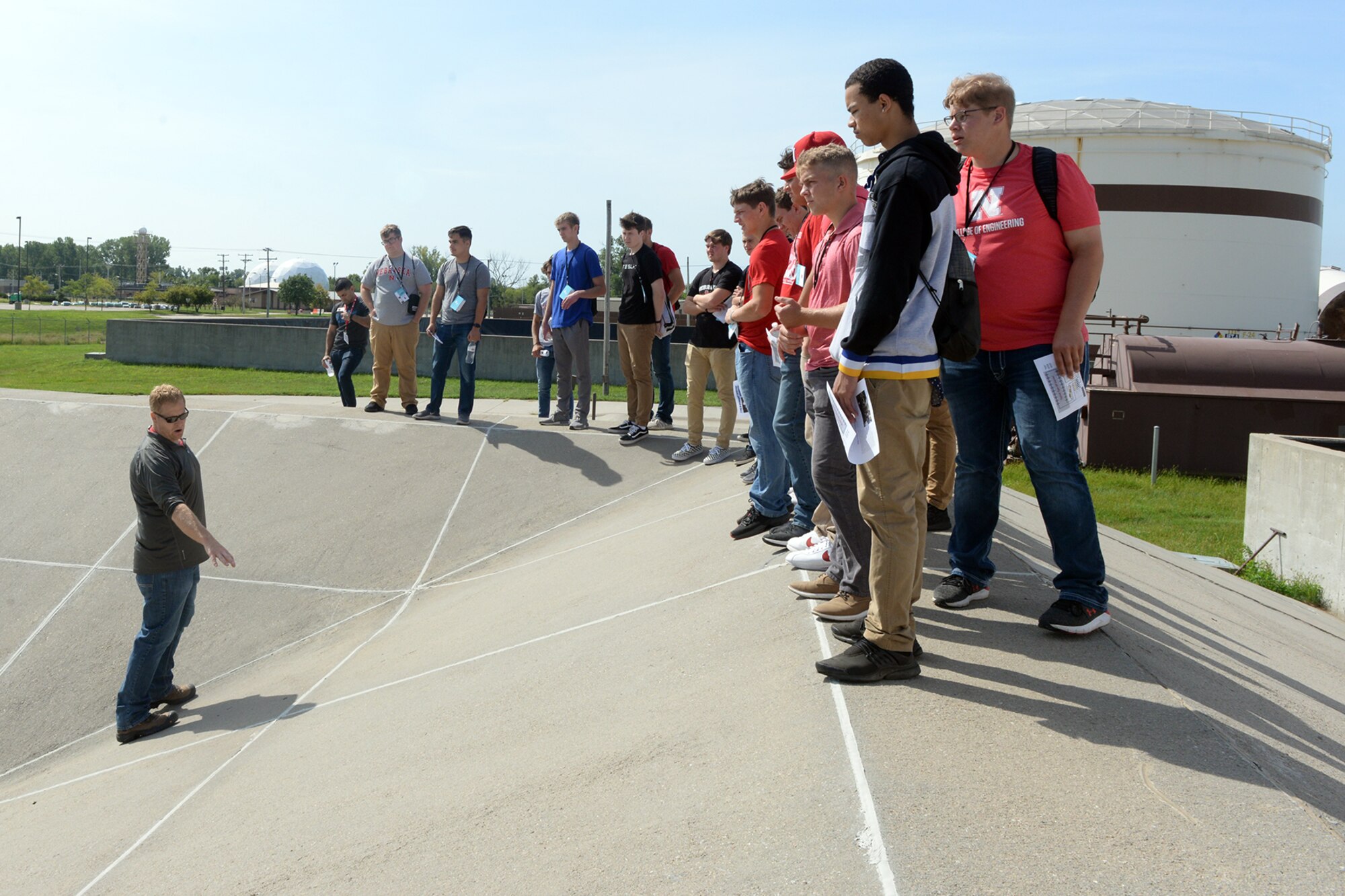 Eric Bausch, U.S. Army Corps of Engineers (USACE) Petroleum, Oil and Lubricants Mandatory Center of Expertise, acting chief, provides a tour of fueling systems to University of Nebraska at Lincoln students Aug. 23, 2019, at Offutt Air Force Base, Nebraska. Local USACE representatives explained that engineers and fueling specialists perform a mission-critical job that helps maintain operations at Offutt.