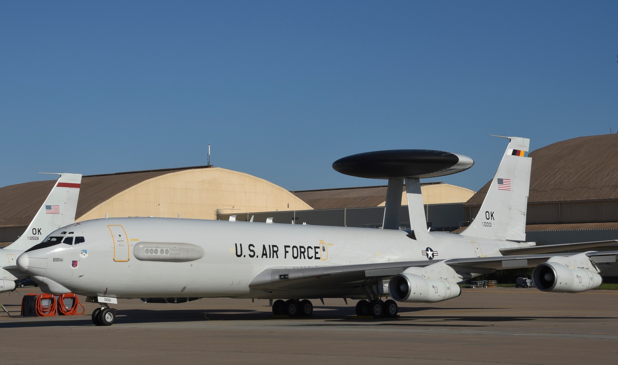 Boeing E-3G Airborne Warning and Control System aircraft, serial # 79-0001, wearing markings for the 552nd Air Control Wing Commander in the form of multi-colored tail-stripe, shadowed tail code and serial number markings on Aug. 12, 2019, Tinker Air Force Base, Oklahoma. The 55nd Air Control Wing, Air Combat Command, generates E-3 AWACS aircraft and crews to support 12th Air Force and Air Forces Southern. The 552nd ACW is known as 'American's Wing' as the largest wing within ACC. (U.S. Air Force photo/Greg L. Davis)
