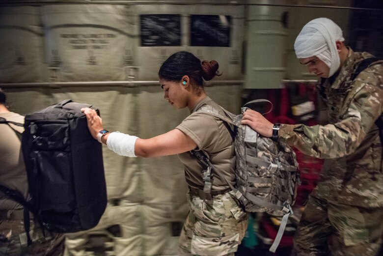 U.S. Army personnel assigned to Camp Zama, Japan role play wounded patients for Operation Ascendant Eagle, a joint-patient movement exercise with the 374th Medical Group on Yokota Air Base, Japan, Aug. 28, 2019. The role-players simulated a swathe of injuries ranging from major head trauma to elevated body temperature. (U.S. Air Force photo by Staff Sgt. Kyle Johnson)