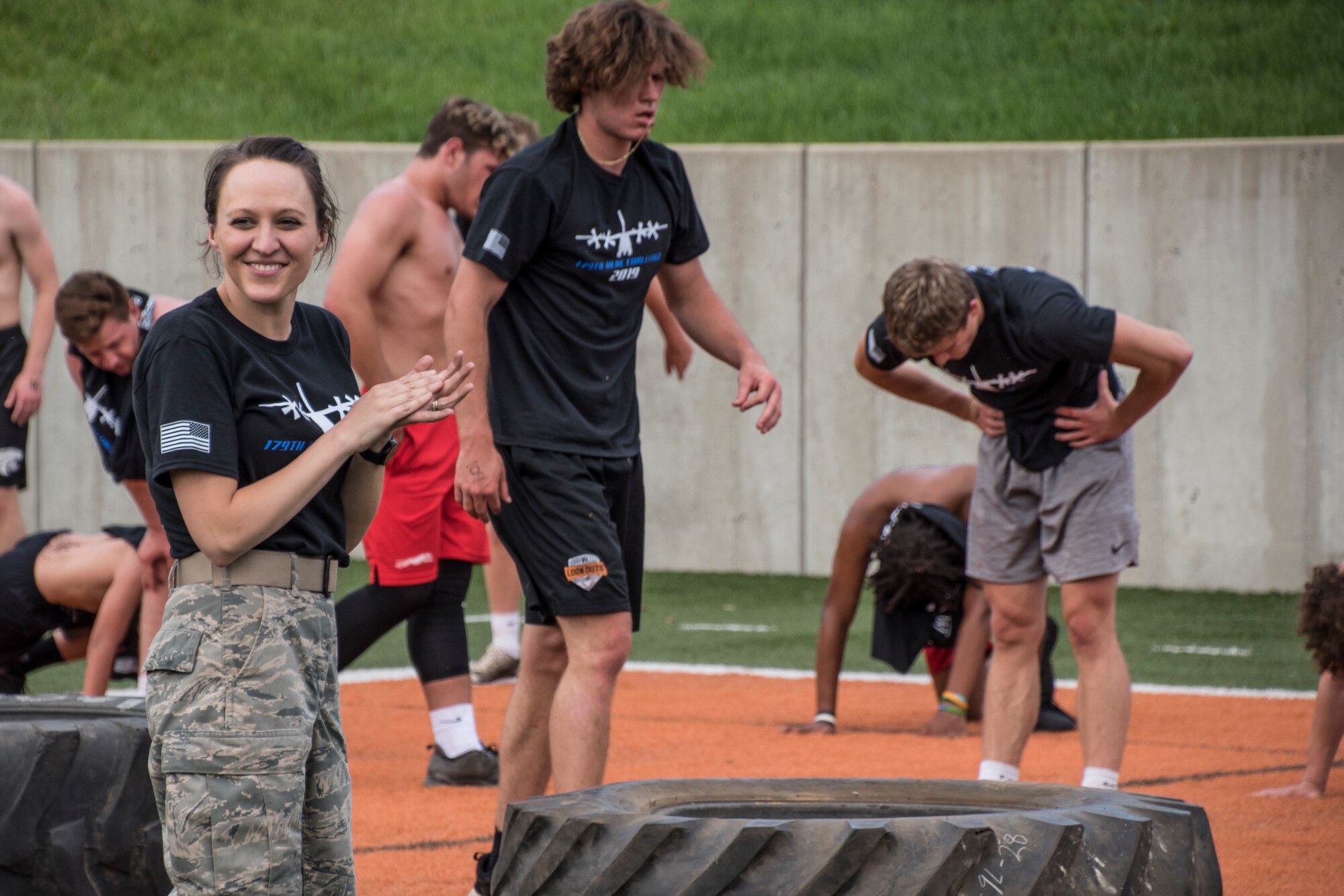 The Mansfield Senior High School Tygers and the Shelby High School Whippets football team participates in the 179th Airlift Wing's "Herc Challenge" held at Arlin Field, Mansfield, Ohio, June 19, 2019. The recruiting event is designed to motivate participants while making them aware of the benefits the Air National Guard can offer them right in their own back yard. (U.S. Air National Guard photo by Airman 1st Class Alexis Wade)