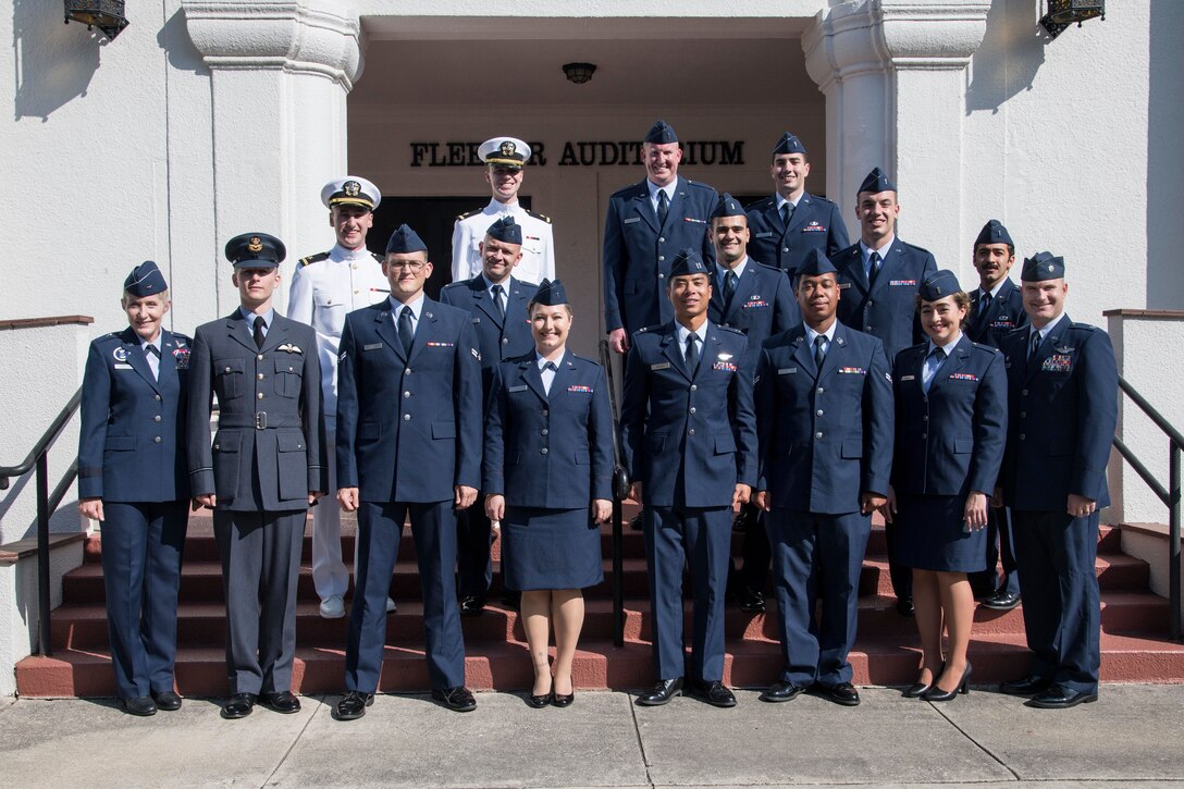 Pilot Training Next students pose for a group photo after graduation from the learning experiment's second iteration with Brig. Gen. Jeannie Leavitt, Air Force Recruiting Service commander, August 29, 2019, at Joint Base San Antonio-Randolph, Texas. PTN is a program to explore and potentially prototype a training environment that integrates various technologies to produce pilots in an accelerated, cost efficient, learning-focused manner. (U.S. Air Force photo by Sean M. Worrell)