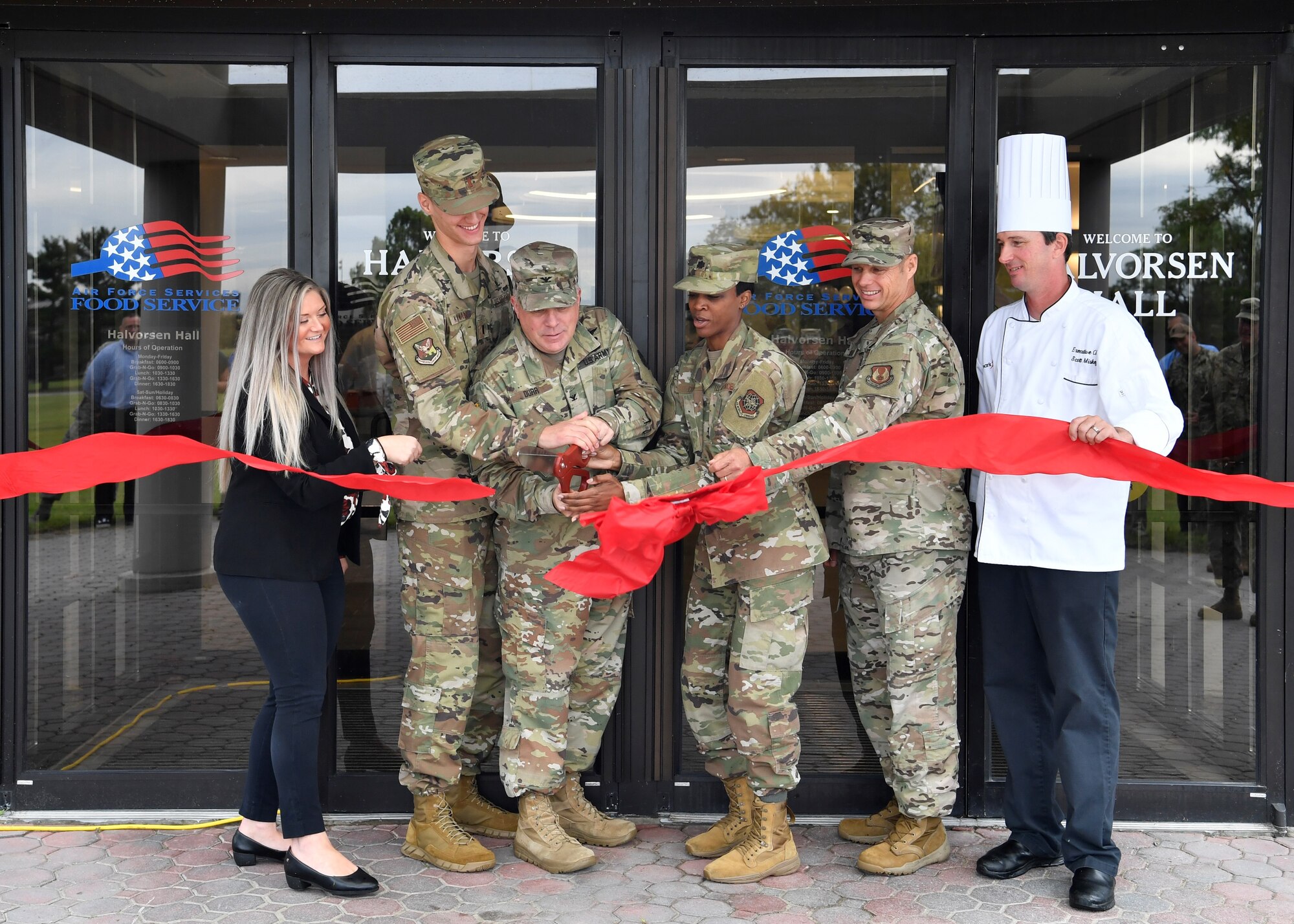 U.S. Army Col. Charles Durr, Army Support Activity commander, along with fellow 87th Air Base Wing Force Support Squadron leadership, cut the ceremonial ribbon for the re-opening of the Halvorsen Hall Dining Facility on Joint Base McGuire-Dix-Lakehurst, New Jersey, Aug. 27, 2019. While closed, the DFAC underwent renovations and changed their food options to align with Food 2.0, an Air Force initiative to offer healthier food options and expanding food choices. An additional change includes utilization of the DFAC for all Joint Base MDL community members.