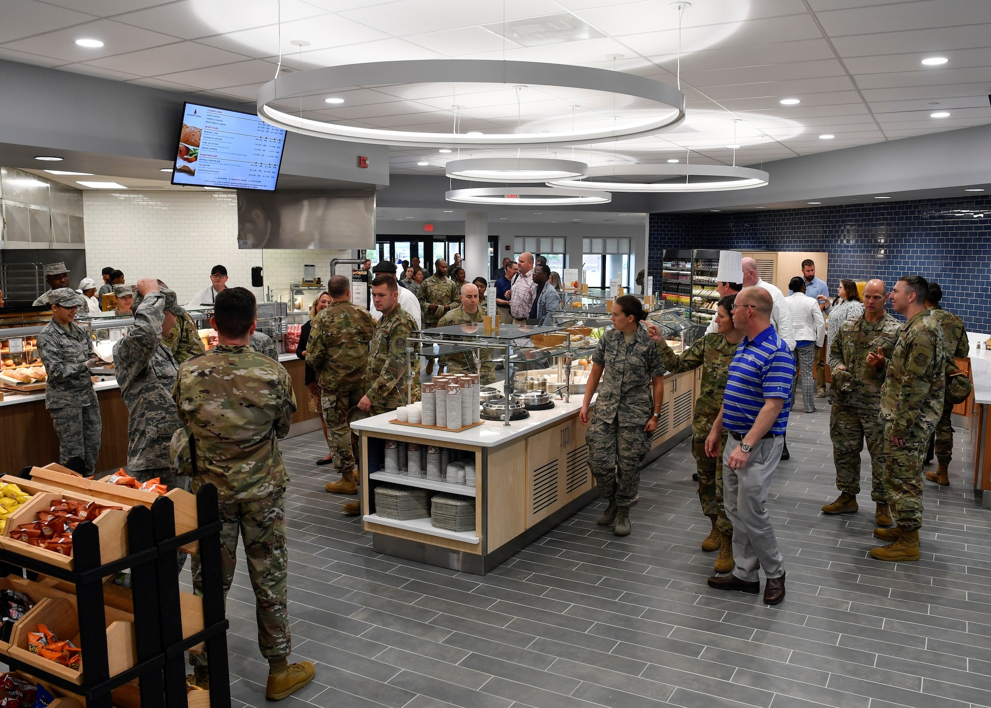 Customers walk around the renovated Halvorsen Hall Dining Facility on Joint Base McGuire-Dix-Lakehurst, New Jersey, during the re-opening on Aug. 27, 2019. The DFAC underwent renovations and transitioned to Food 2.0, an Air Force initiative to bring healthier food options to individuals while also expanding food choices. An additional change includes utilization of the DFAC for all Joint Base MDL community members.