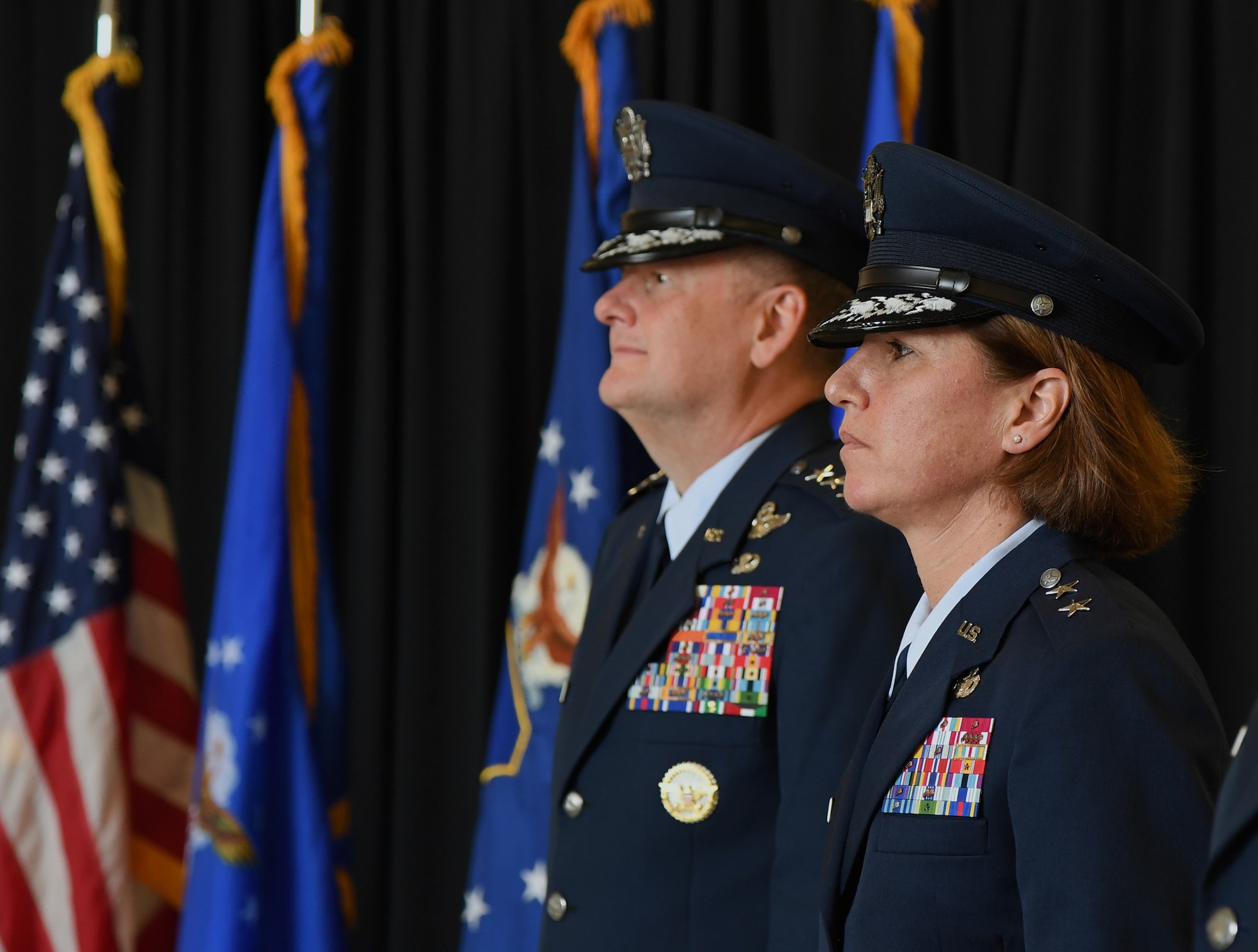 U.S. Air Force Lt. Gen. Brad Webb, commander of Air Education and Training Command, and Maj. Gen. Andrea Tullos, Second Air Force commander, stand at attention during the Second Air Force change of command ceremony on Keesler Air Force Base, Mississippi, Aug. 29, 2019. The ceremony is a symbol of command being exchanged from one commander to the next. Tullos assumed command of the Second Air Force from Maj. Gen. Timothy Leahy. (U.S. Air Force photo by Kemberly Groue)