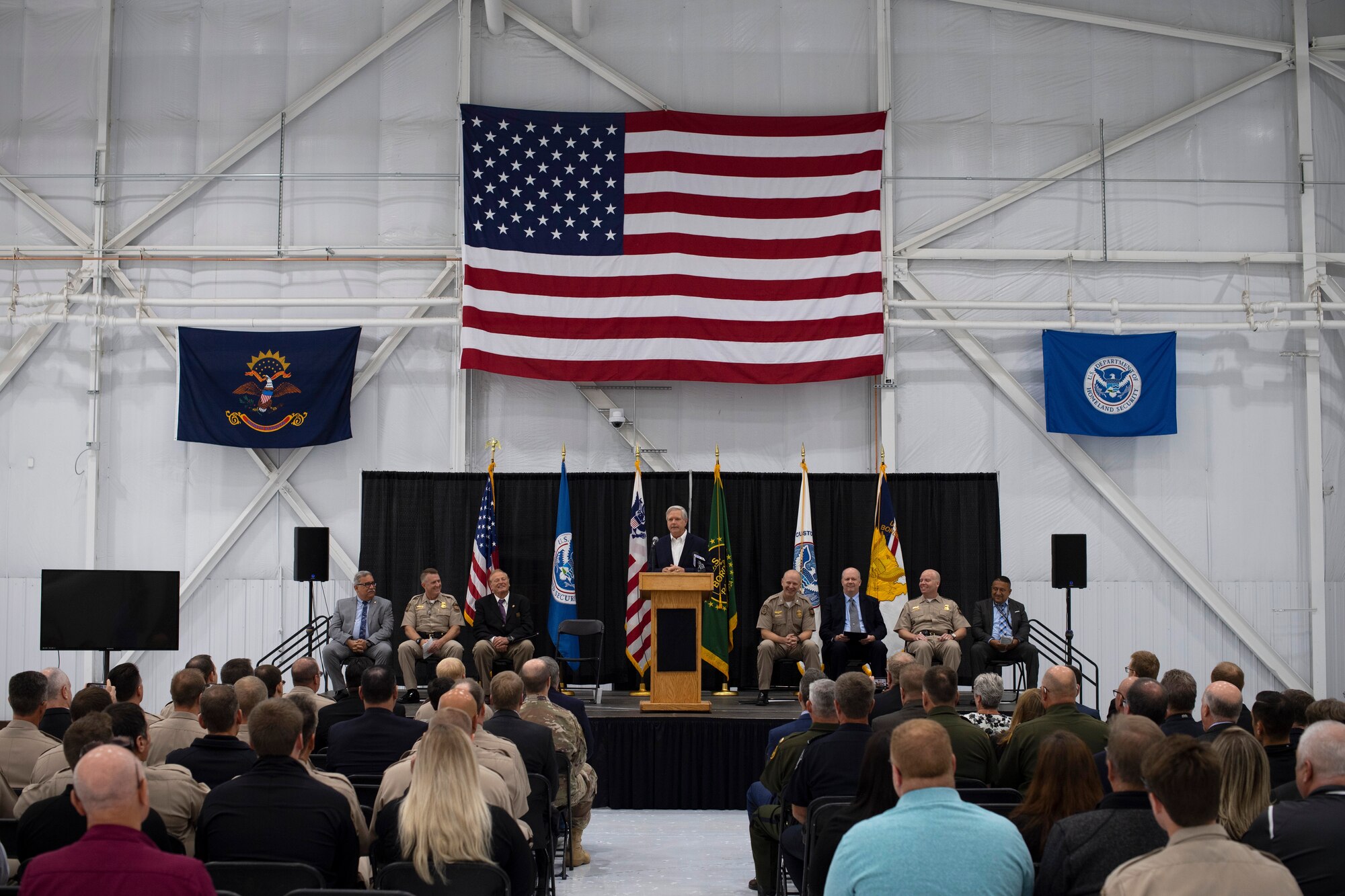North Dakota Senator John Hoeven offers remarks during a ceremony August 28, 2019, on Grand Forks Air Force Base, North Dakota. The ceremony marked the official opening of U.S. Customs and Border Protection’s newly-renovated National Air Security Operations Center, an unmanned aerial system training center on base. (U.S. Air Force photo by Senior Airman Elora J. Martinez)