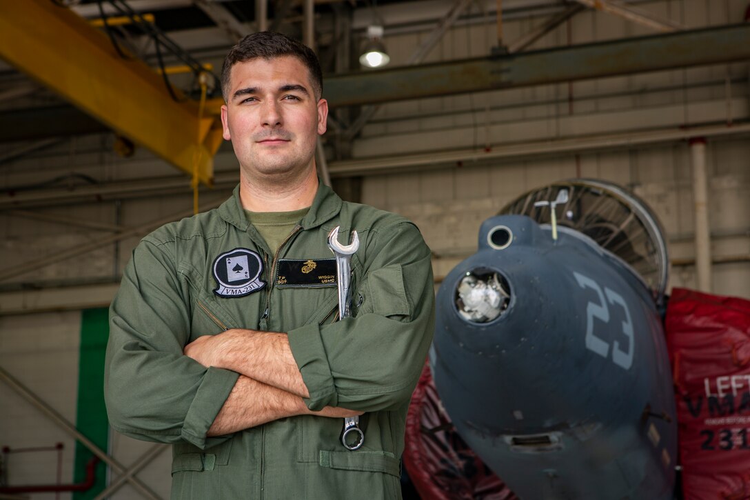 Sgt. Tristan Wiggin, a fixed-wing aircraft safety equipment mechanic with Marine Attack Squadron 231, 2nd Marine Aircraft Wing, poses for a photo at Marine Corps Cherry Point, N.C., Aug. 27, 2019. "Embrace the act of learning to satisfy your curiosity," said Wiggin, a Marshfield, Mass., native. According to his leadership, Wiggin was nominated for direct contributions to VMA-231's mission accomplishment by managing the Egress Systems Checkout and Aviation Breathing Oxygen programs, which are both critical inspection cycles resulting in zero discrepancies. He also serves as the safety equipment noncommissioned officer-in-charge for VMA-231. (U.S. Marine Corps photo by Staff Sgt. William L. Holdaway)
