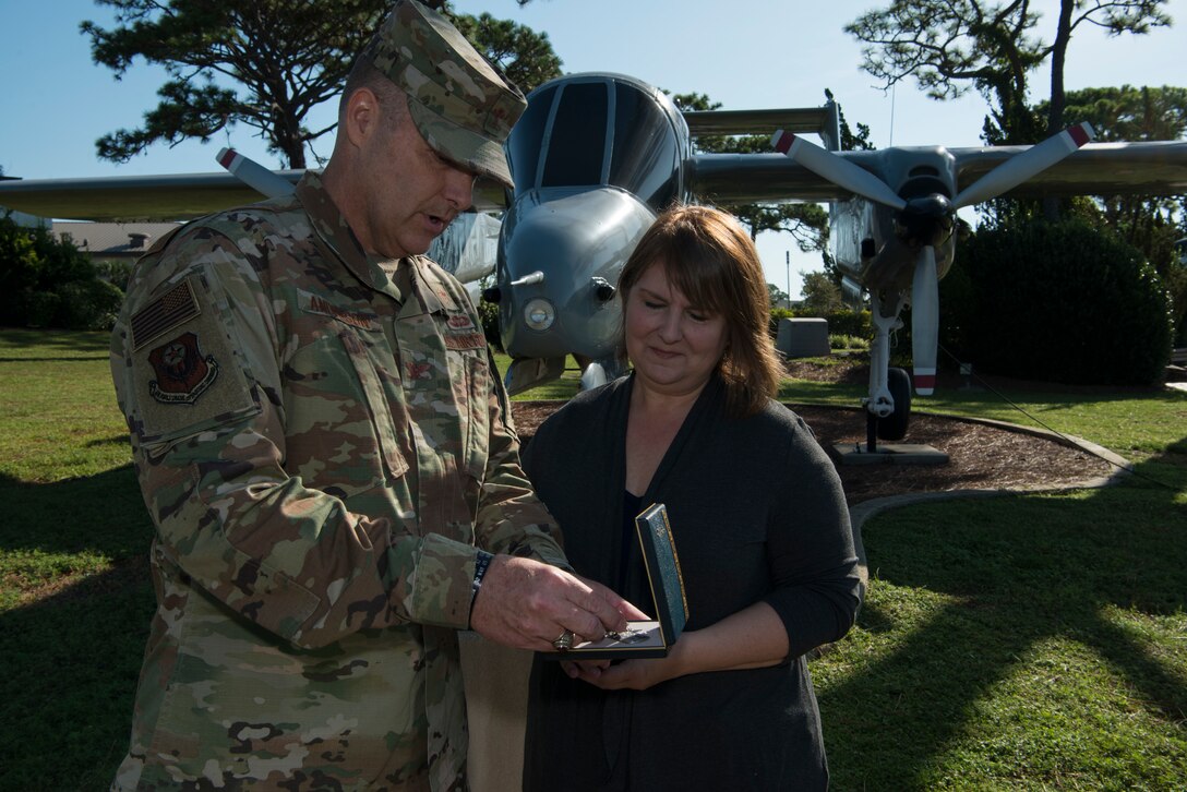 Two people standing together in an airpark.