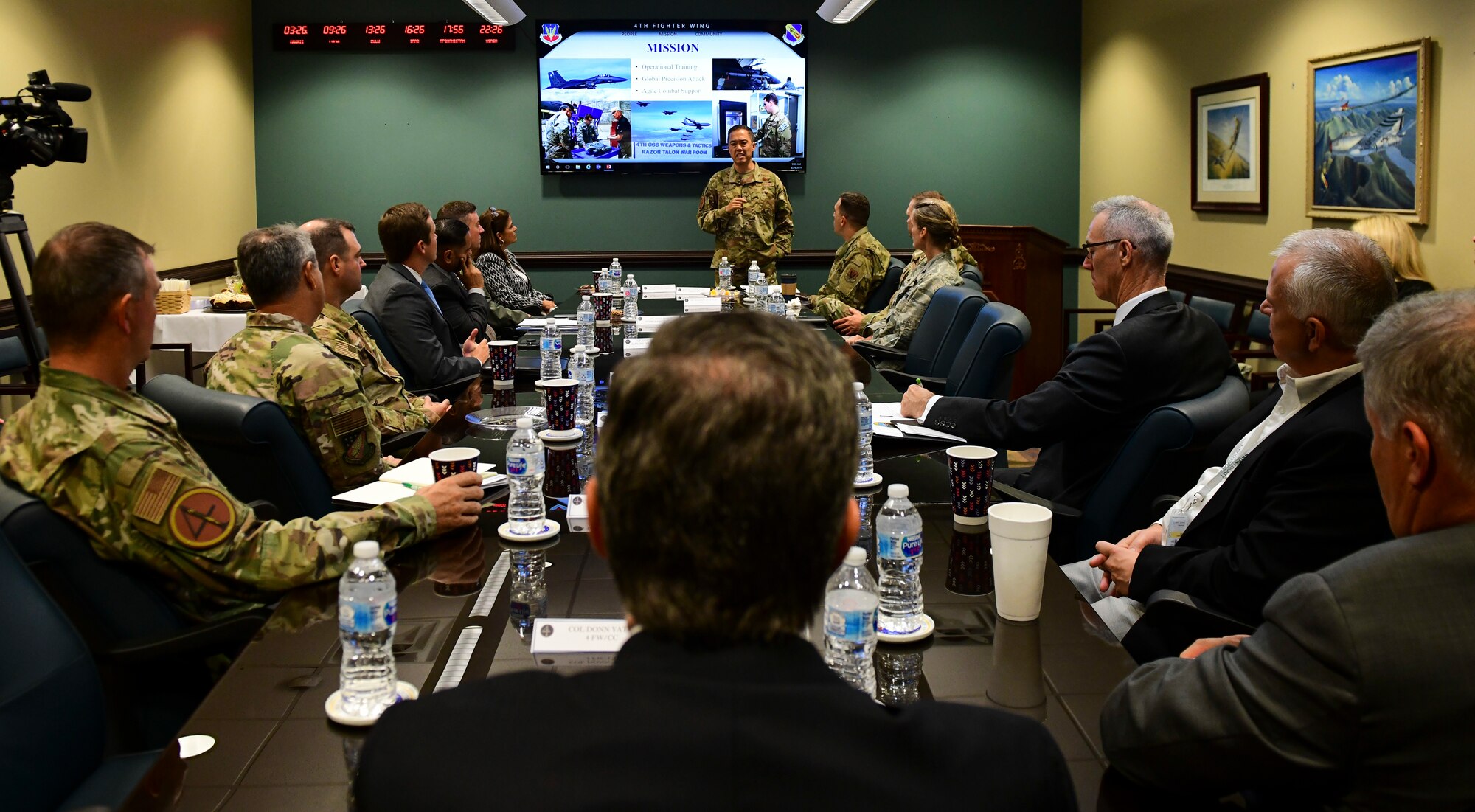 Col. Donn Yates, 4th Fighter Wing commander, briefs base leadership, North Carolina Governor Roy Cooper, and representatives from Wayne County and Goldsboro during a mission brief at Seymour Johnson Air Force Base, North Carolina, August 29, 2019. The brief focused on the mission of the 4 FW, it’s people, and the relationship between the base, Goldsboro, Wayne County, and North Carolina. (U.S. Air Force photo by Senior Airman Kenneth Boyton)