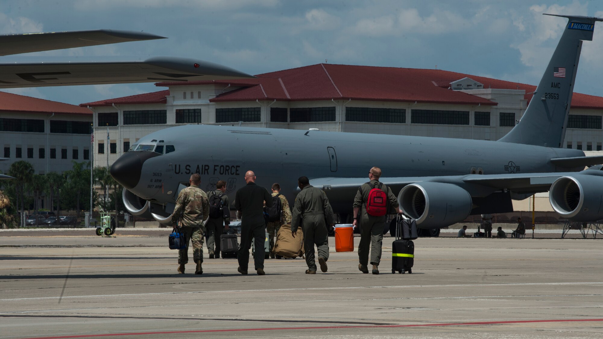 An aircrew from the 91st Air Refueling Squadron, walks toward a KC-135 Stratotanker, Aug. 29, 2019, on the flightline at MacDill Air Force Base, Fla. MacDill’s leadership team ordered the departure of the KC-135’s as a precautionary measure in preparation for Hurricane Dorian. (U.S. Air Force photo by Airman 1st Class Shannon Bowman)