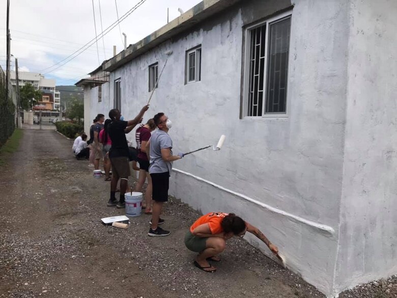 Airmen paint a church during a mission trip to Kingston, Jamaica, Aug. 8, 2019. During the 21st Space Wing-hosted mission trip, Airmen put up dry wall, plastered walls and painted the church, demonstrating the Air Force core value of service before self. (U.S. Air Force courtesy photo)