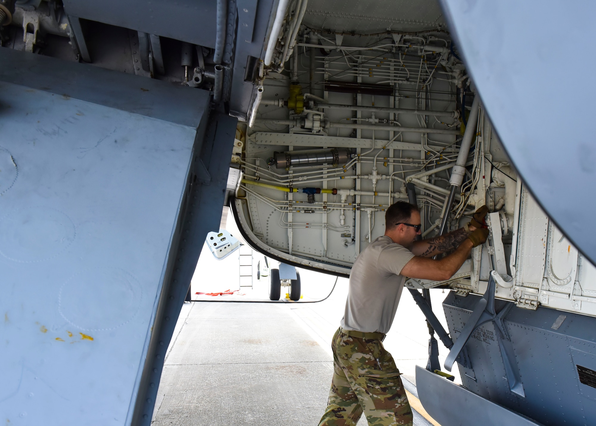 U.S. Air Force Tech Sgt. Patrick Forbes, 92nd Aircraft Maintenance Squadron flying crew chief, prepares a KC-135 Stratotanker for aerial refueling.
