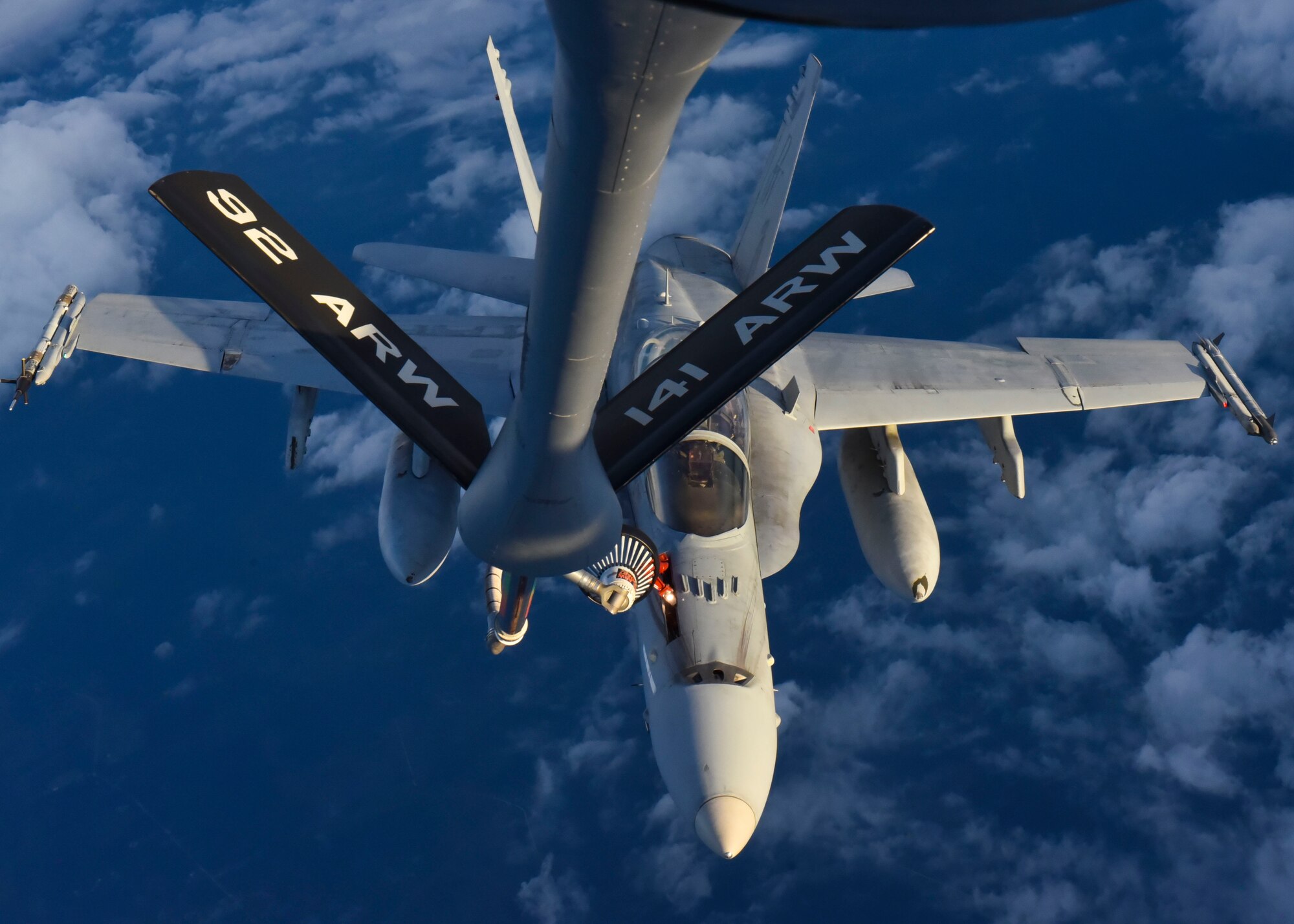 A U.S. Marine Corps F/A-18C Hornet from Marine Aircraft Group 31, South Carolina, gets refueled by a KC-135 Stratotanker