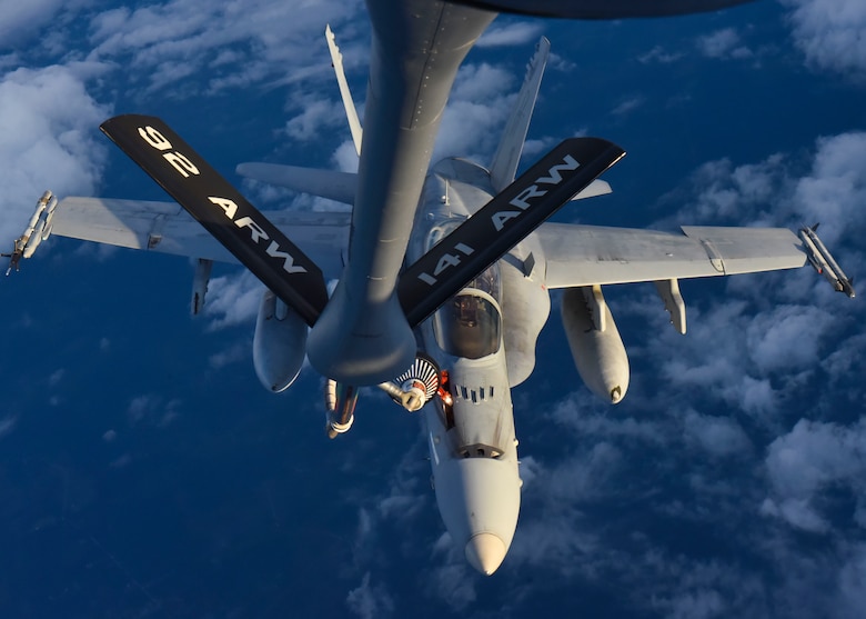 A U.S. Marine Corps F/A-18C Hornet from Marine Aircraft Group 31, South Carolina, gets refueled by a KC-135 Stratotanker