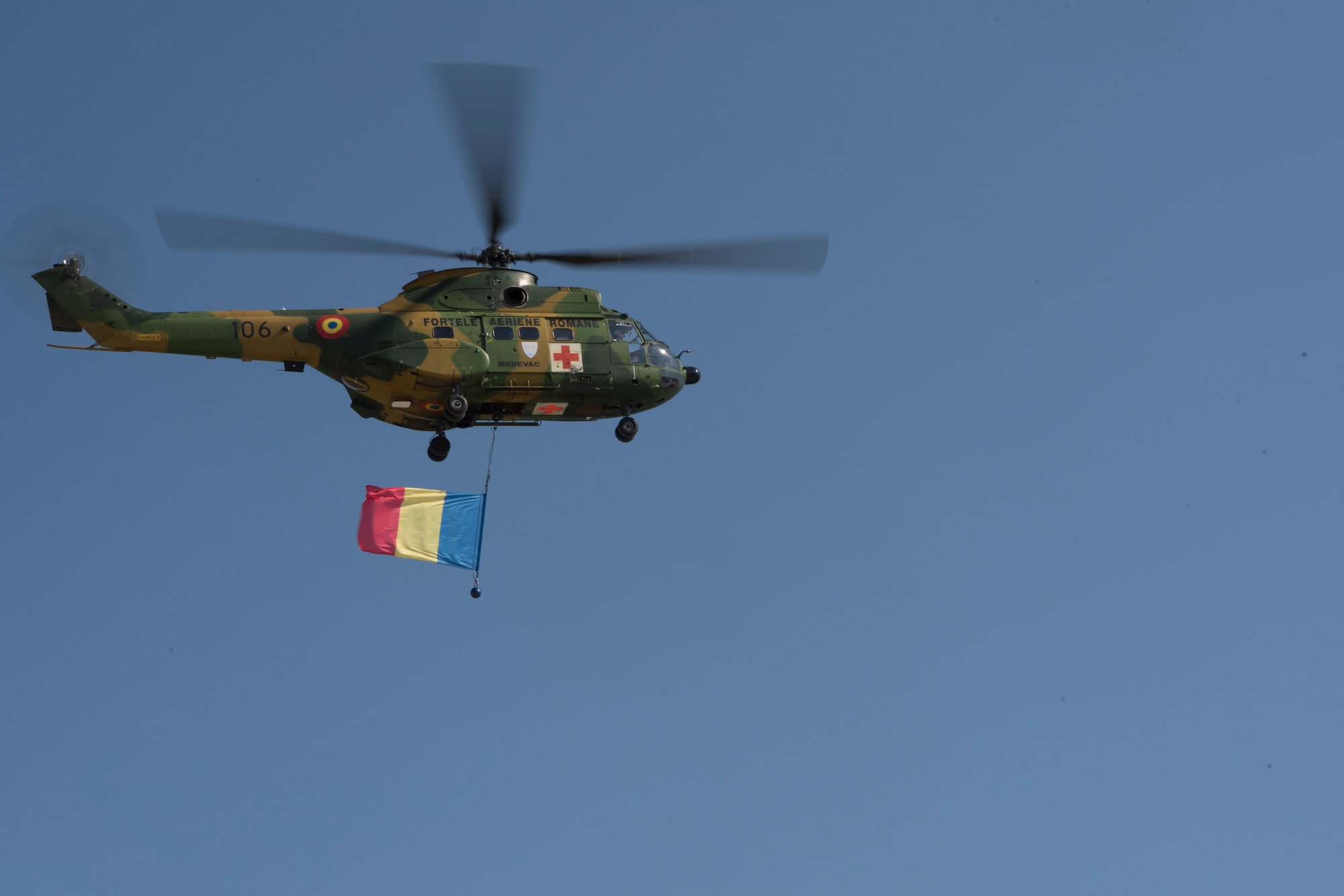 A Romanian air force paramedic helicopter returns from an air show held near Otopeni Air Base, Romania, Aug. 24, 2019. The air show, occurring at the same time as exercise Carpathian Fall, required a lot of time and resources from the Romanian air force. (U.S. Air Force photo by Senior Airman Kristof J. Rixmann)