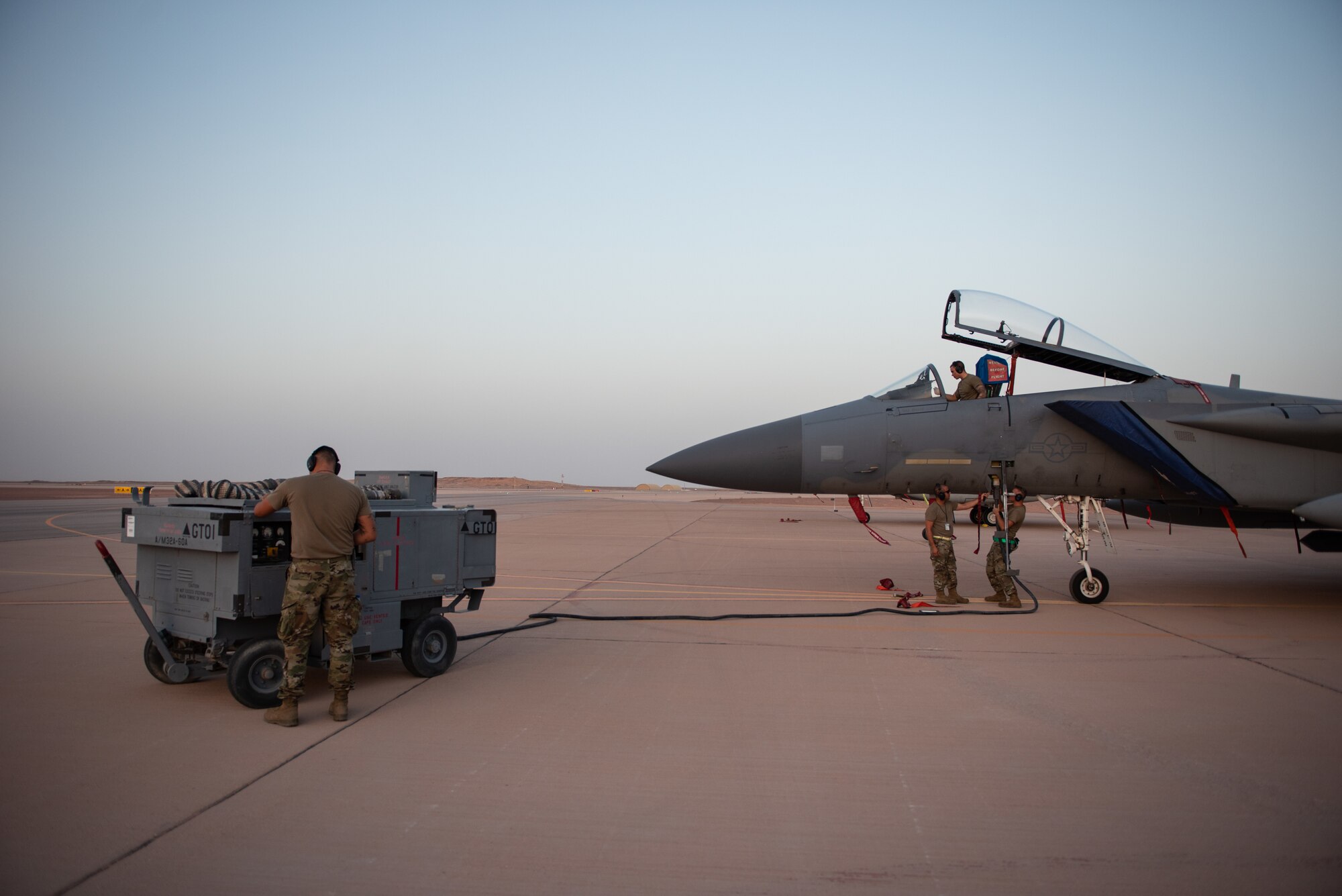 380th Expeditionary Aircraft Maintenance Squadron crew chiefs, power an F-15C Eagle during exercise Hype Eagle Aug. 18, 2019, at Prince Sultan Air Base, Saudi Arabia. The 159th Expeditionary Fighter Squadron forward deployed to challenge their flexibility at expanding tactical and strategical reach while strengthening coalition and regional partnerships in the U.S. Central Command area of responsibility. (U.S. Air Force photo by Staff Sgt. Chris Thornbury)