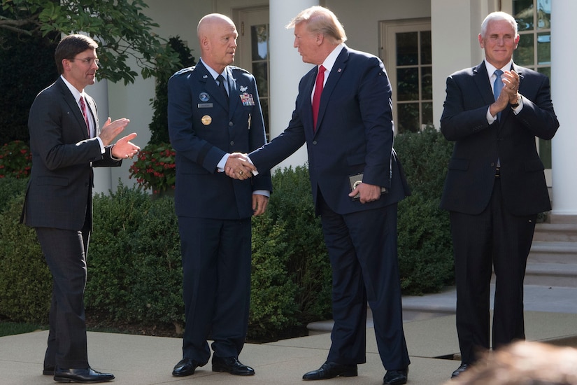 President Donald J. Trump shakes hands with an Air Force general.
