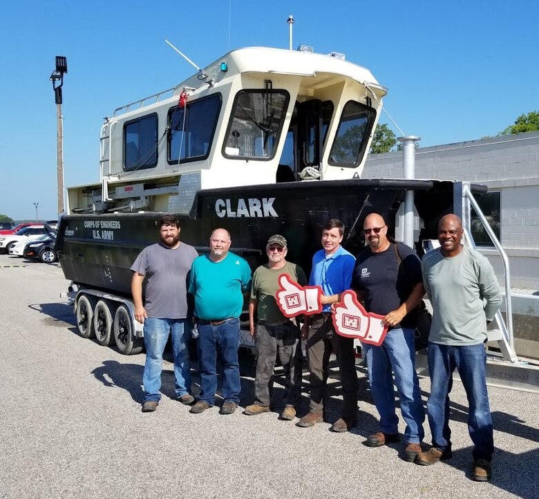 IN THE PHOTO, from left to right, are Cory Roberts (Electrician Leaderman), Joseph "Clay" Hurt (Carpenter), Mikel "Buck" Buchanan (Marine Mechanic), Kevin Woods (Chief of Plant Section), Chris Reger (Rock Island District Dredge Coordinator), and Marvin Roddy (Chief of Shops Unit).