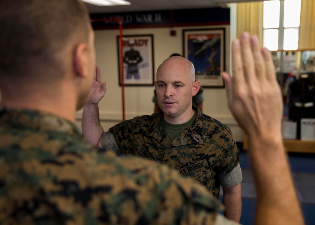 U.S. Marine Corps Gunnery Sergeant Matthew R. Phagan, a Music Technical Assistant with 6th Marine Corps District, recites the oath of enlistment during his reenlistment ceremony at the 6th Marine Corps District Headquarters aboard Marine Corps Recruit Depot Parris Island, South Carolina on August 29, 2019. Phagan is a native of Daleville, Alabama. (U.S. Marine Corps photo by Cpl. Jack A. E. Rigsby)