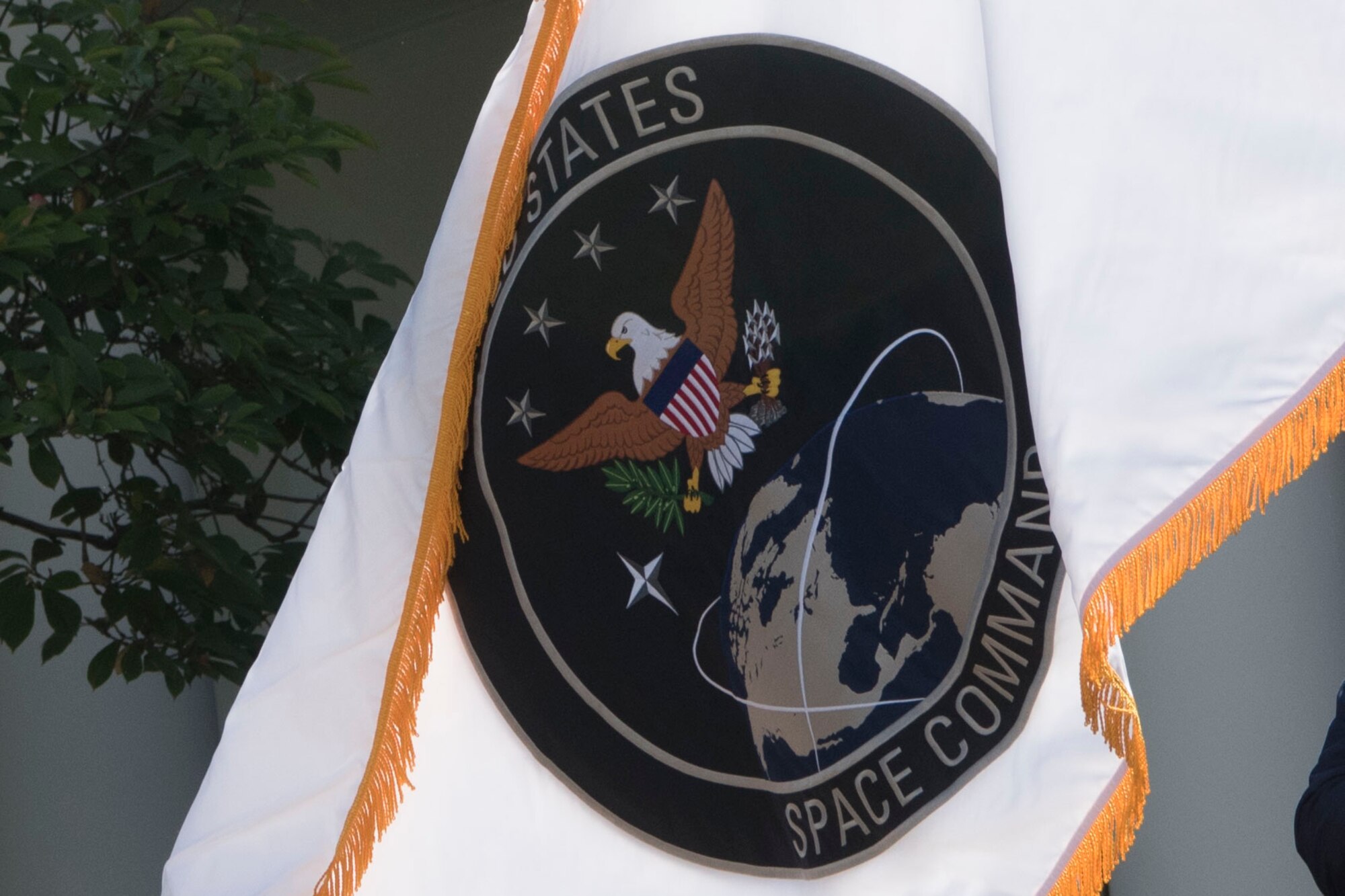 The flag of the U.S. Space Command is unfurled at the White House in a presentation with President Donald J. Trump, the incoming commander of U.S. Space Command, Air Force Gen. John W. Raymond, Vice President Mike Pence, Secretary of Defense Dr. Mark T. Esper, and Air Force Command Chief Master Sergeant Roger Towberman, Washington, D.C., Aug. 29, 2019.