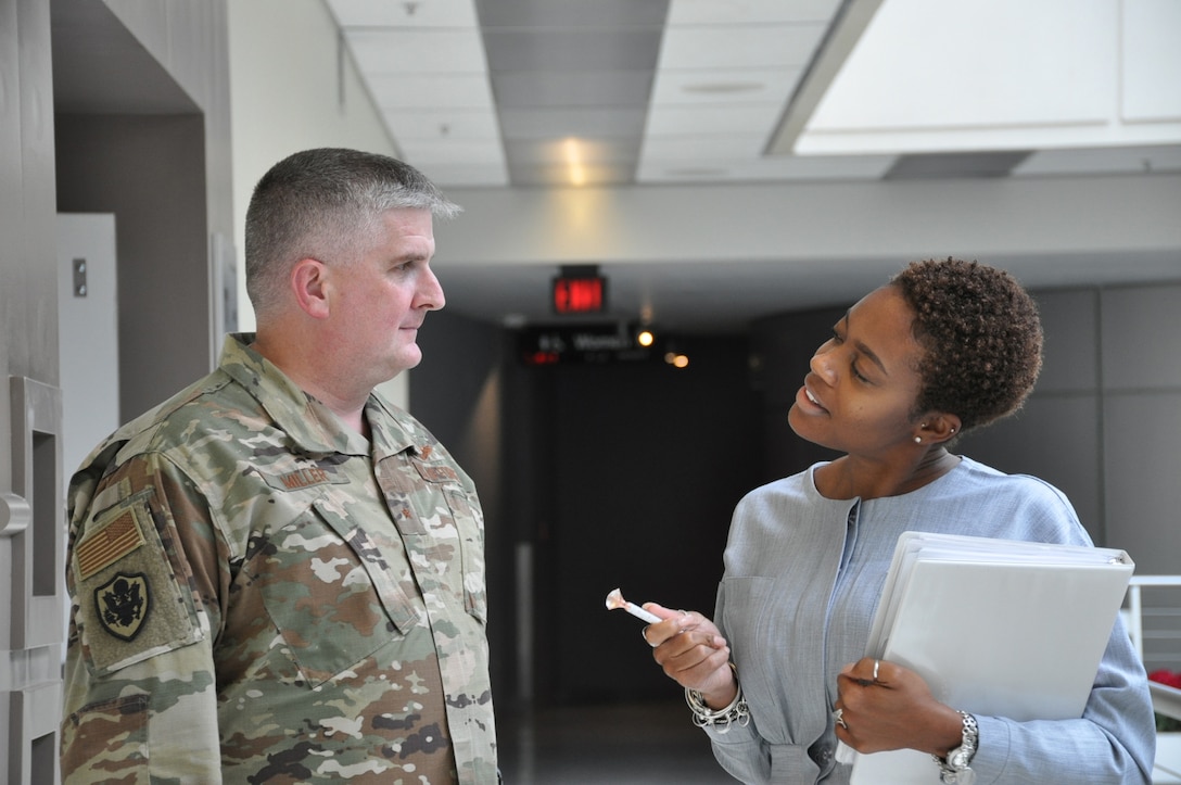 Air Force Brig. Gen. Albert Miller stands with Keisha High.