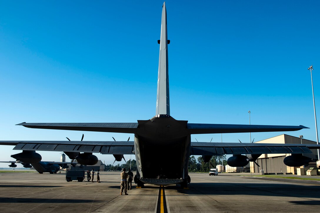 Airmen from the 71st Aircraft Maintenance Unit prepare an HC-130J Combat King II for takeoff Aug. 30, 2019, at Moody Air Force Base (AFB), Ga. The aircraft was used to transport personnel and equipment to Little Rock AFB, Ark. in support of Hurricane Dorian aircraft relocation efforts. (U.S. Air Force photo by Senior Airman Erick Requadt)