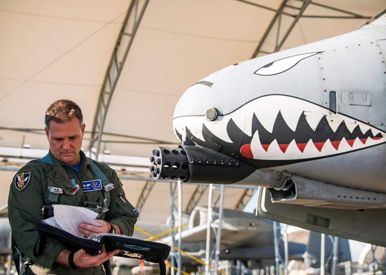 Maj. Brendhan Goss, 74th Fighter Squadron assistant director of operations, reads a flight plan prior to departing for Little Rock Air Force Base, Ark., Aug. 30, 2019, at Moody Air Force Base, Ga. Moody’s A-10C Thunderbolt II’s were relocated to Little Rock in anticipation of Hurricane Dorian. (U.S. Air Force photo by Airman 1st Class Eugene Oliver)