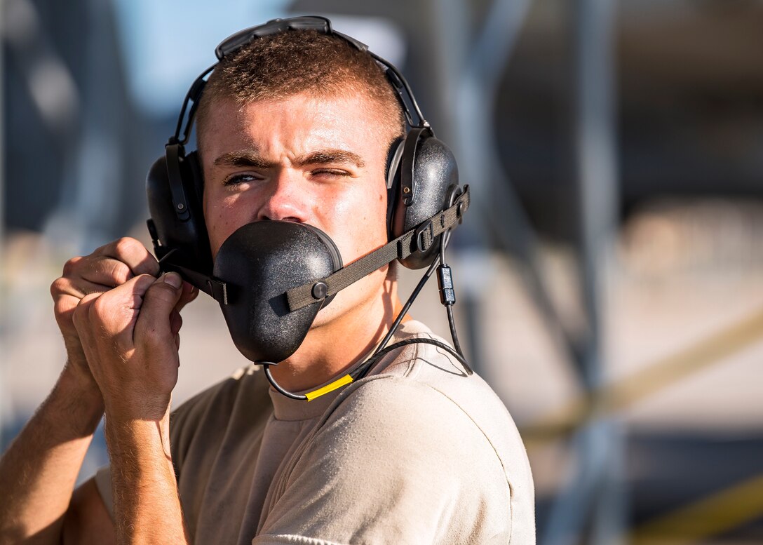 Airman 1st Class Colin Glennen, 74th Aircraft Maintenance Unit crew chief, secures his personal protection equipment prior to marshaling an aircraft departing for Little Rock Air Force Base, Ark., Aug. 30, 2019, at Moody AFB, Ga. Moody’s A-10C Thunderbolt II’s were relocated to Little Rock in anticipation of Hurricane Dorian. (U.S. Air Force photo by Airman 1st Class Eugene Oliver)