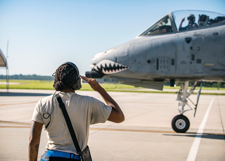 Senior Airman Tori Payne, left, 74th Aircraft Maintenance Unit crew chief, salutes a pilot from the 74th Fighter Squadron prior to takeoff for Little Rock AFB, Ark., Aug. 30, 2019, at Moody Air Force Base, Ga. Moody’s A-10C Thunderbolt II’s were relocated to Little Rock in anticipation of Hurricane Dorian. (U.S. Air Force photo by Airman 1st Class Eugene Oliver)