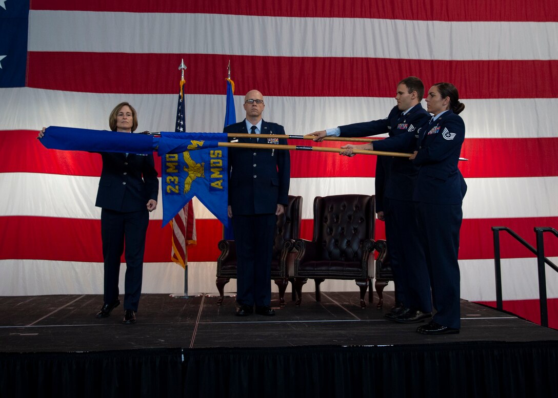 Col. Tiffany Morgan, 23d Medical Group commander, uncovers the 23d Operational Medical Readiness Squadron guidon during a redesignation ceremony, Aug. 30, 2019, at Moody Air Force Base, Ga. The redesignation ceremony marked the transition of both the 23d Aerospace Medicine Squadron to the 23d Operational Medical Readiness Squadron and the 23d Medical Operations Squadron to the 23d Healthcare Operations Squadron. The redesignation was part of an Air Force-wide medical transformation directive to provide more effective and efficient ways to care for Team Moody Airman and restore squadron readiness to execute the mission. (U.S. Air Force photo by Airman Azaria E. Foster)
