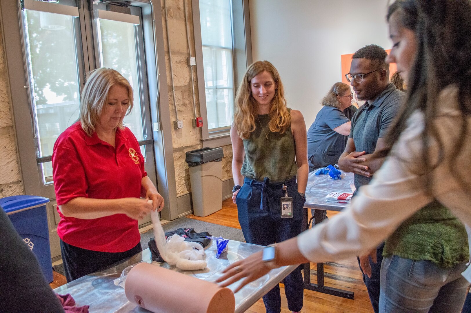 Gina Pickard, Trauma Division manager at Brooke Army Medical Center’s Trauma Clinic, shows City of San Antonio council staff members how to pack a wound during Stop the Bleed held at the Plaza de Armas building in downtown San Antonio Aug. 29. The training consisted of a presentation where attendees learned the “ABCs of Bleeding Control” along with some hands-on practice in applying tourniquets, packing wounds and applying direct pressure to stop bleeding.