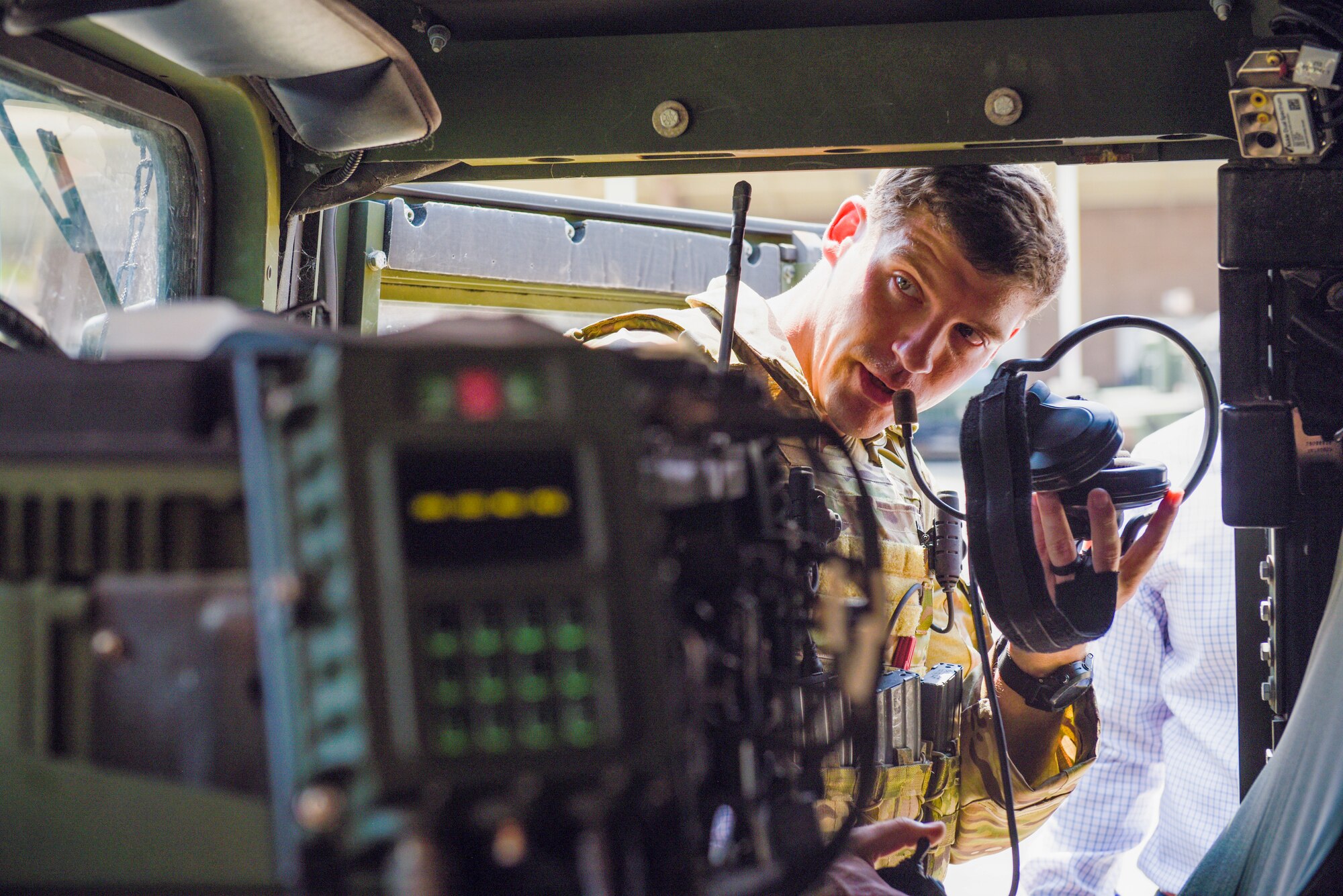 A U.S. Air Force joint terminal attack controller, assigned to the 165th Air Support Squadron, 165th Airlift Wing; Georgia Air National Guard, performs a sound check while giving a presentation of their communication system installed in their Humvee called a Battlefield Airman System of Integrated Communications (BASIC) in Savannah, Ga. on August 13, 2019. The BASIC allows JTAC airmen to establish communications on multiple frequencies including HF, UHF, VHF, FM and SATCOM radios all while being protected from harsh conditions in an armored vehicle following a natural disaster. (U.S. Air National Guard photo by Staff Sgt. Caila Arahood)