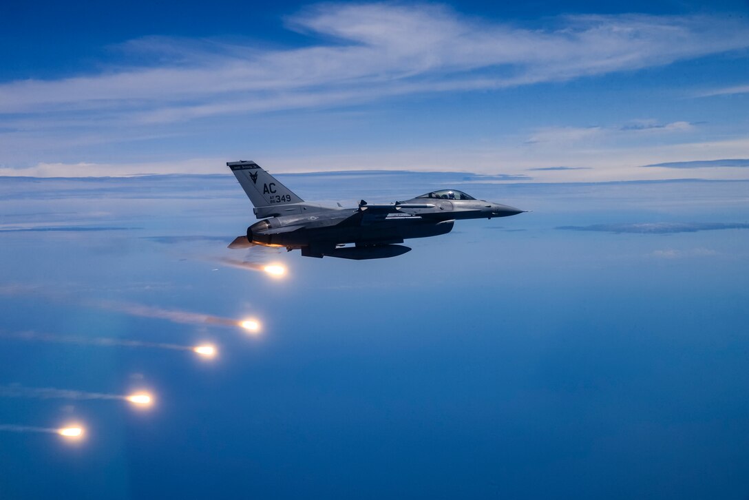 A picture of a U.S. Air Force F-16C Fighting Falcon fires flares over the Atlantic Ocean.