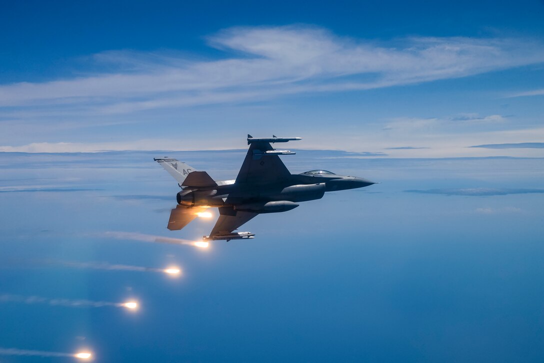 A picture of a U.S. Air Force F-16C Fighting Falcon fires flares over the Atlantic Ocean.
